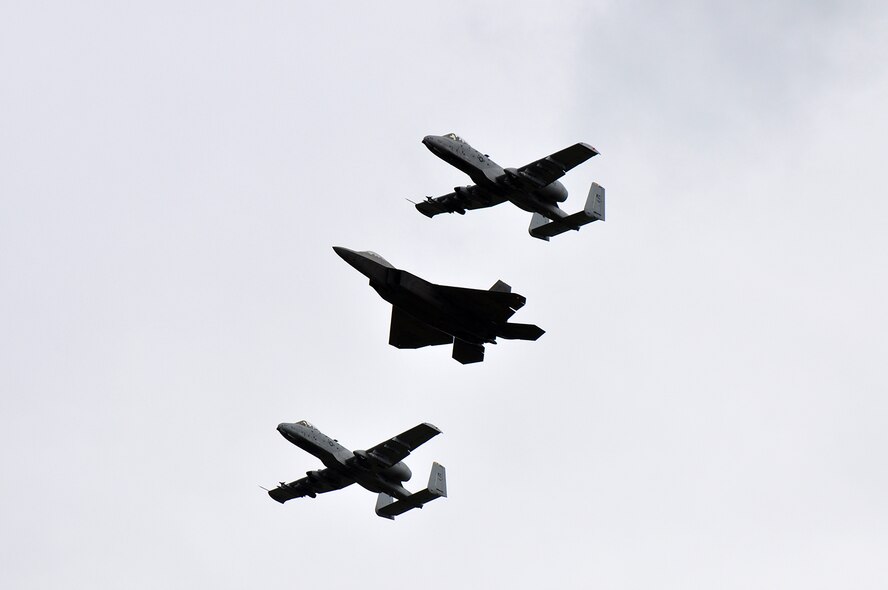 An F-22 Raptor from Tyndall Air Force Base in Fla., is escorted by two A-10 Thunderbolt IIs from Whiteman Air Force Base in Mo., into Amari Air Base Sept. 4.  The F-22 landing here was part of a media day event hosted by the Estonian military as part of Operation Atlantic Resolve. The U.S military is partnering with European NATO allies to show dedication to peace in the region. (U.S. Air Force photo by Capt. Denise Haeussler)