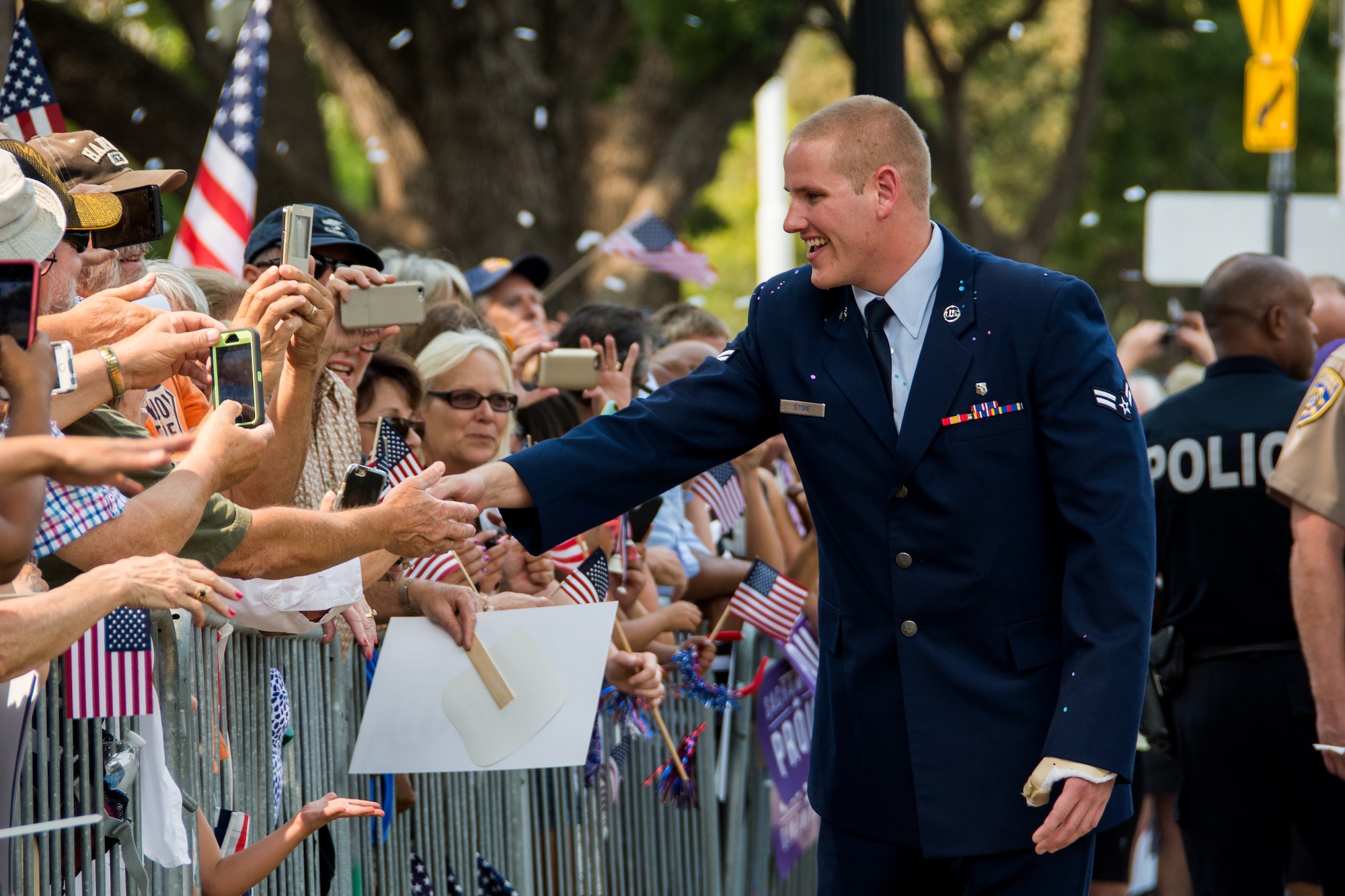 Airman 1st Class Spencer Stone is greeted with a hero's welcome during the Sacramento Hometown Heroes Parade and festivities at the state capitol building in downtown Sacramento, California, Sept. 11, 2015. Hundreds of people lined the streets of downtown Sacramento to welcome home and honor Stone, Anthony Sadler and Alek Skarlatos. The trio of friends are responsible for thwarting a terrorist attack aboard a train headed toward Paris Aug. 21. (U.S. Air Force photo/Senior Airman Charles Rivezzo)
