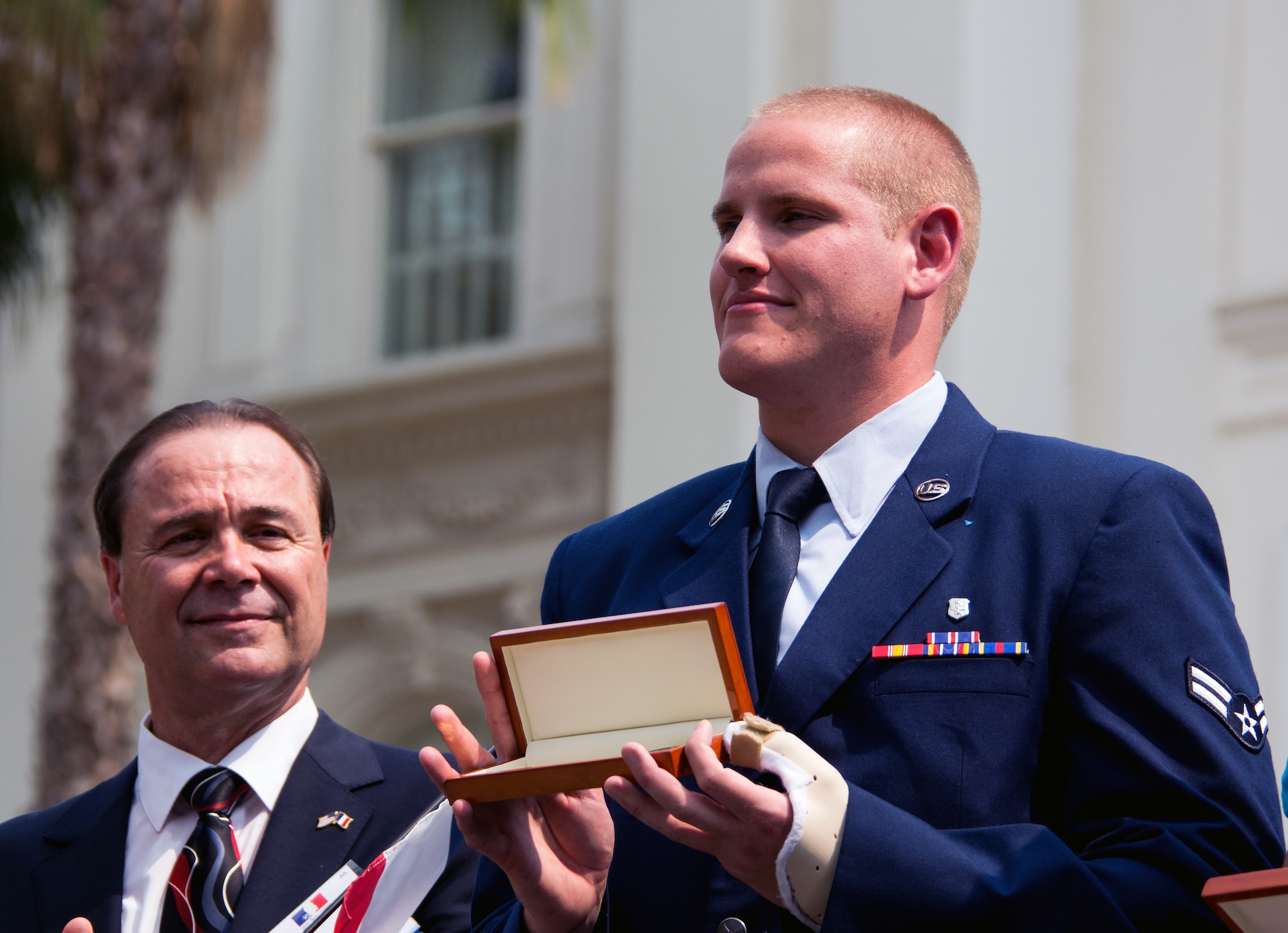 Airman 1st Class Spencer Stone receives a ceremonial key to the city from Mayor Kevin Johnson during the Sacramento Hometown Heroes Parade and festivities in Sacramento, California, Sept. 11, 2015. (U.S. Air Force photo/Senior Airman Charles Rivezzo)