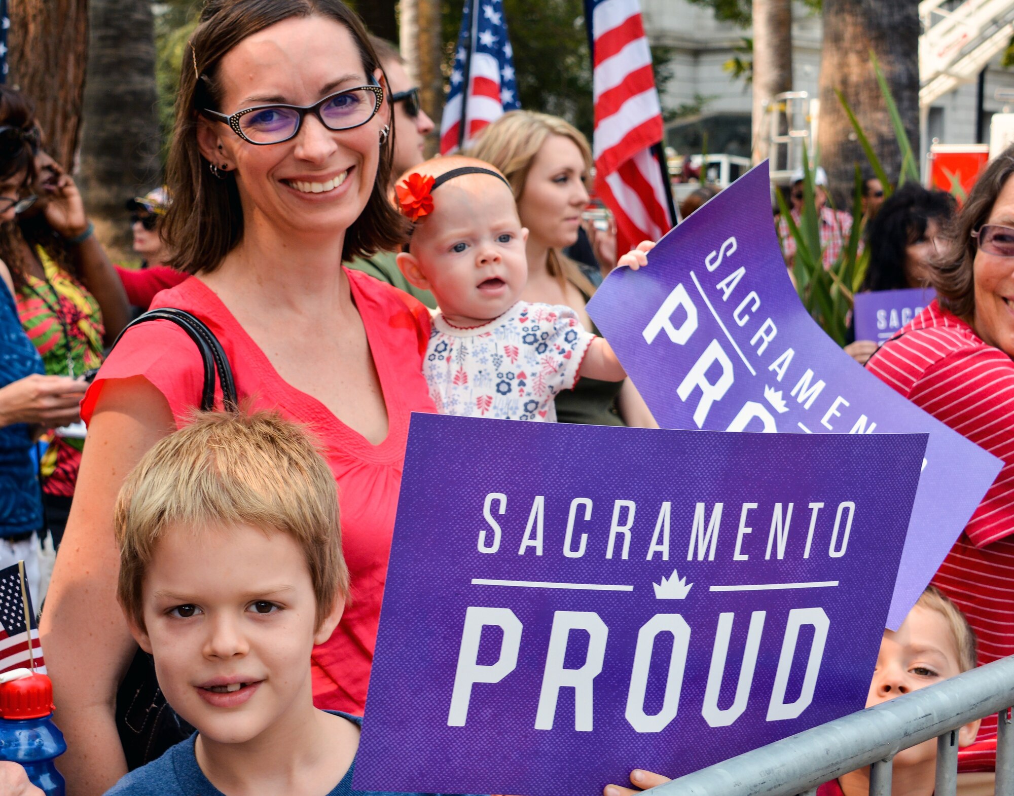 A Sacramento resident and her family gather at the state capitol building in downtown Sacramento, California, to welcome home Airman 1st Class Spencer Stone, Anthony Sadler and Alek Skarlatos during the Sacramento Hometown Heroes Parade and festivities, Sept. 11, 2015. The trio of friends are responsible for thwarting a terrorist attack aboard a train headed toward Paris Aug. 21. (U.S. Air Force photo/Senior Airman Charles Rivezzo)