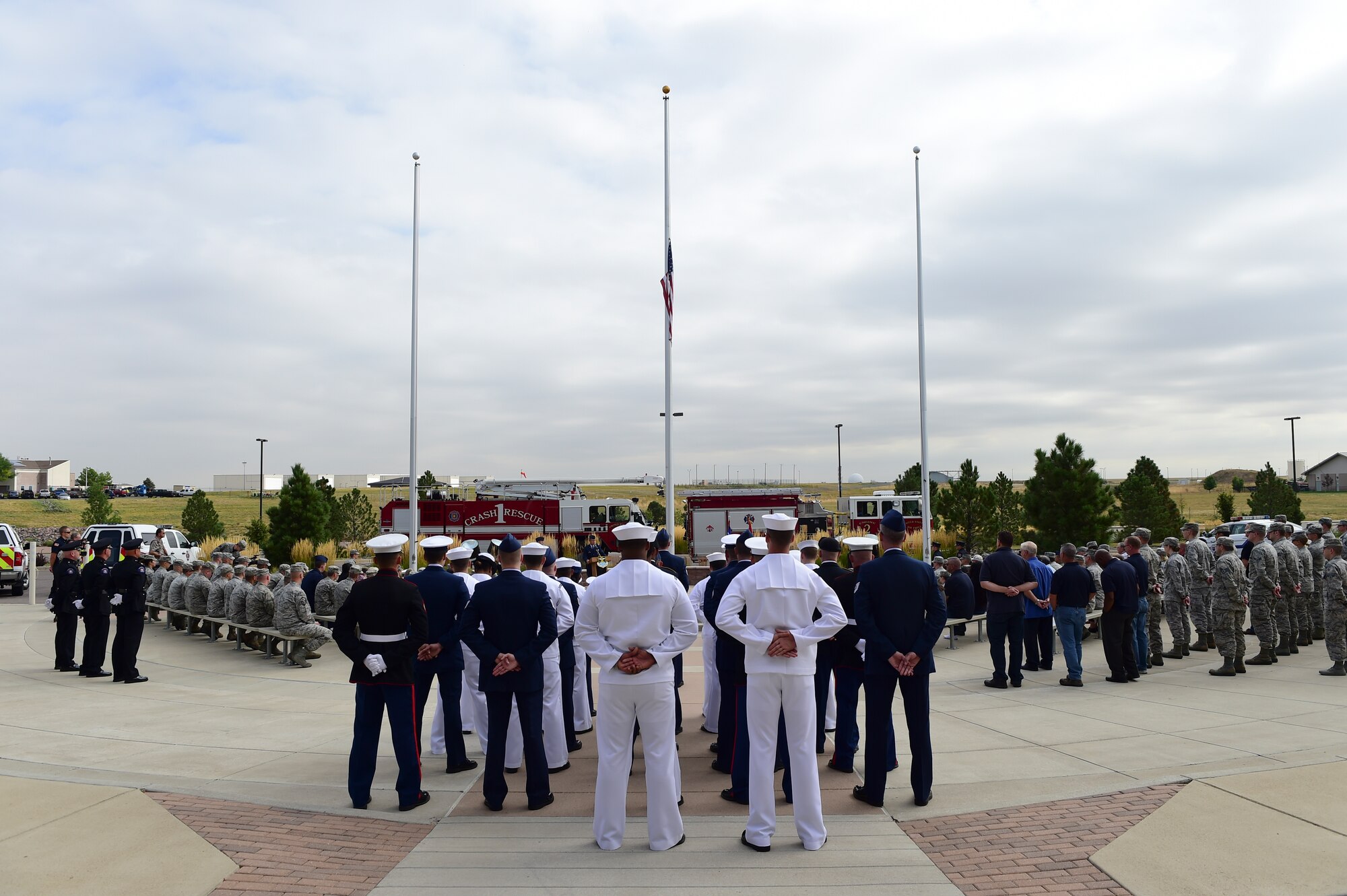 Members of Team Buckley remember those who fell during the events of Sept. 11, 2001, as part of the Patriot Day Ceremony Sept. 11, 2015, at the Headquarters Building on Buckley Air Force Base, Colo. Patriot Day is the national day of service and remembrance, in memory of the thousands killed on U.S. soil in the 9/11 attacks. (U.S. Air Force photo by Senior Airman Phillip Houk/Released)