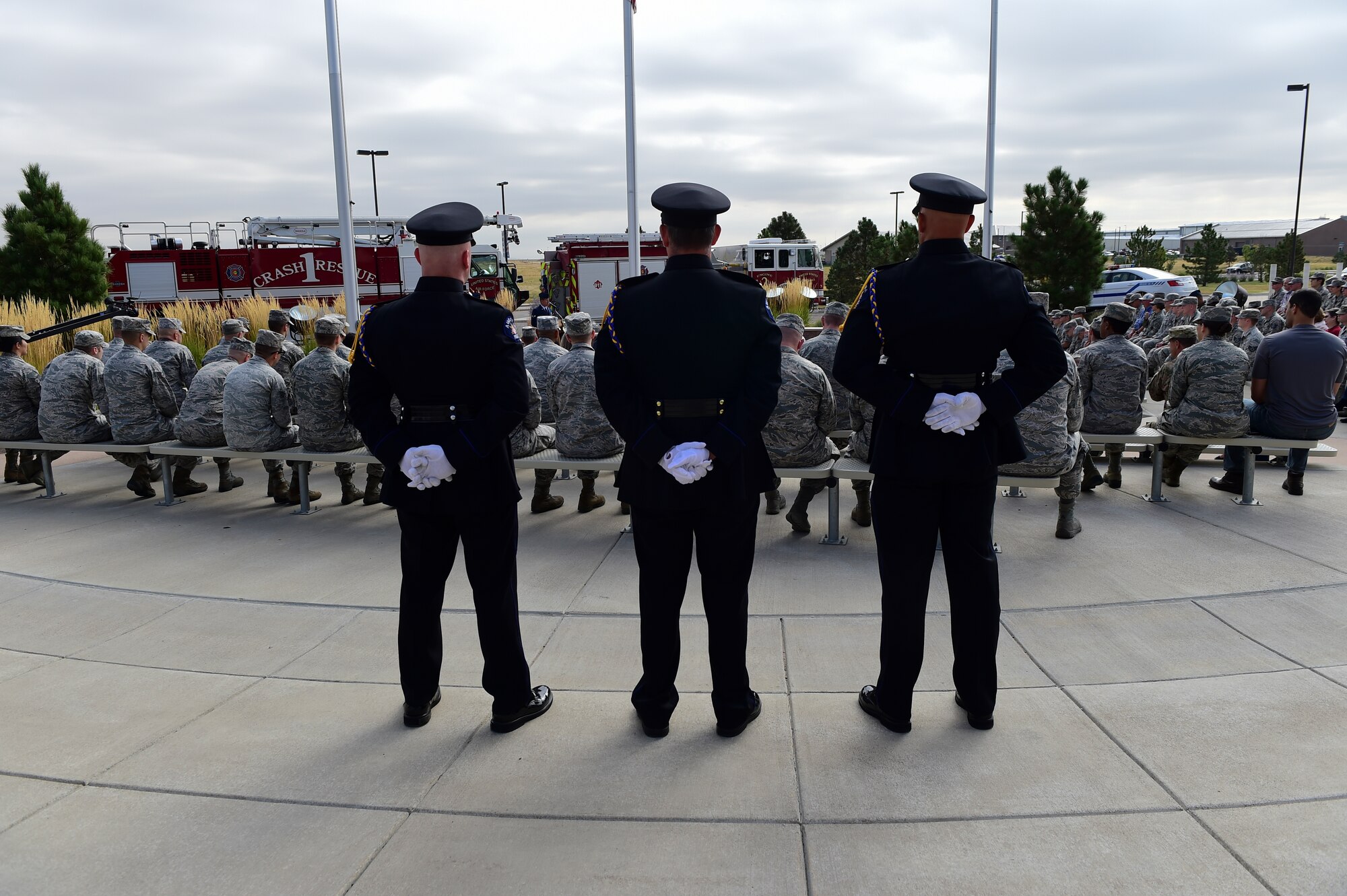 Members of the Aurora Police Department Honor Guard observe Patriot Day with Team Buckley members Sept. 11, 2015, at the Headquarters Building on Buckley Air Force Base, Colo. Patriot Day is the national day of service and remembrance, in memory of the thousands killed on U.S. soil in the 9/11 attacks. (U.S. Air Force photo by Senior Airman Phillip Houk/Released)