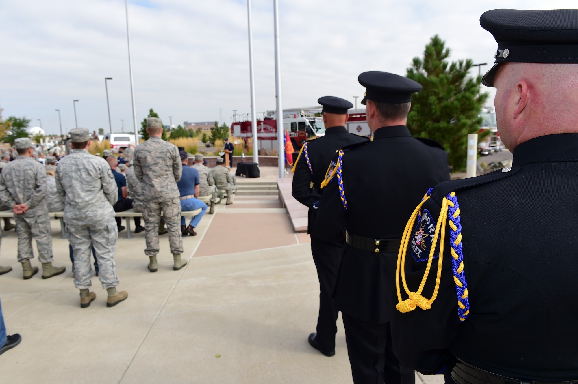 Members of the Aurora Police Department Honor Guard prepare to raise the U.S. flag during the Patriot Day Ceremony Sept. 11, 2015, at the Headquarters Building on Buckley Air Force Base, Colo. Patriot Day is the national day of service and remembrance, in memory of the thousands killed on U.S. soil in the 9/11 attacks. (U.S. Air Force photo by Senior Airman Phillip Houk/Released)