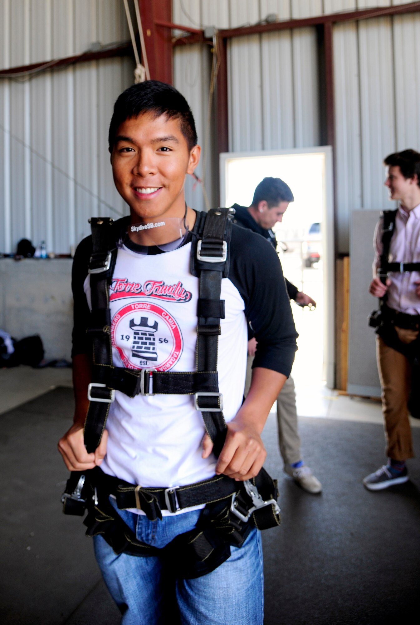 Airman 1st Class Jerzees Fernandez, 30th Civil Engineer Squadron electrical system journeyman, awaits to sky dive, Sep. 5, 2015, Lompoc Airport, Calif. Single Airman Initiative organizes monthly activities that provide Airmen the opportunity to explore the area and meet new people. (U.S. Air Force photo by Senior Airman Kyla Gifford/Released)