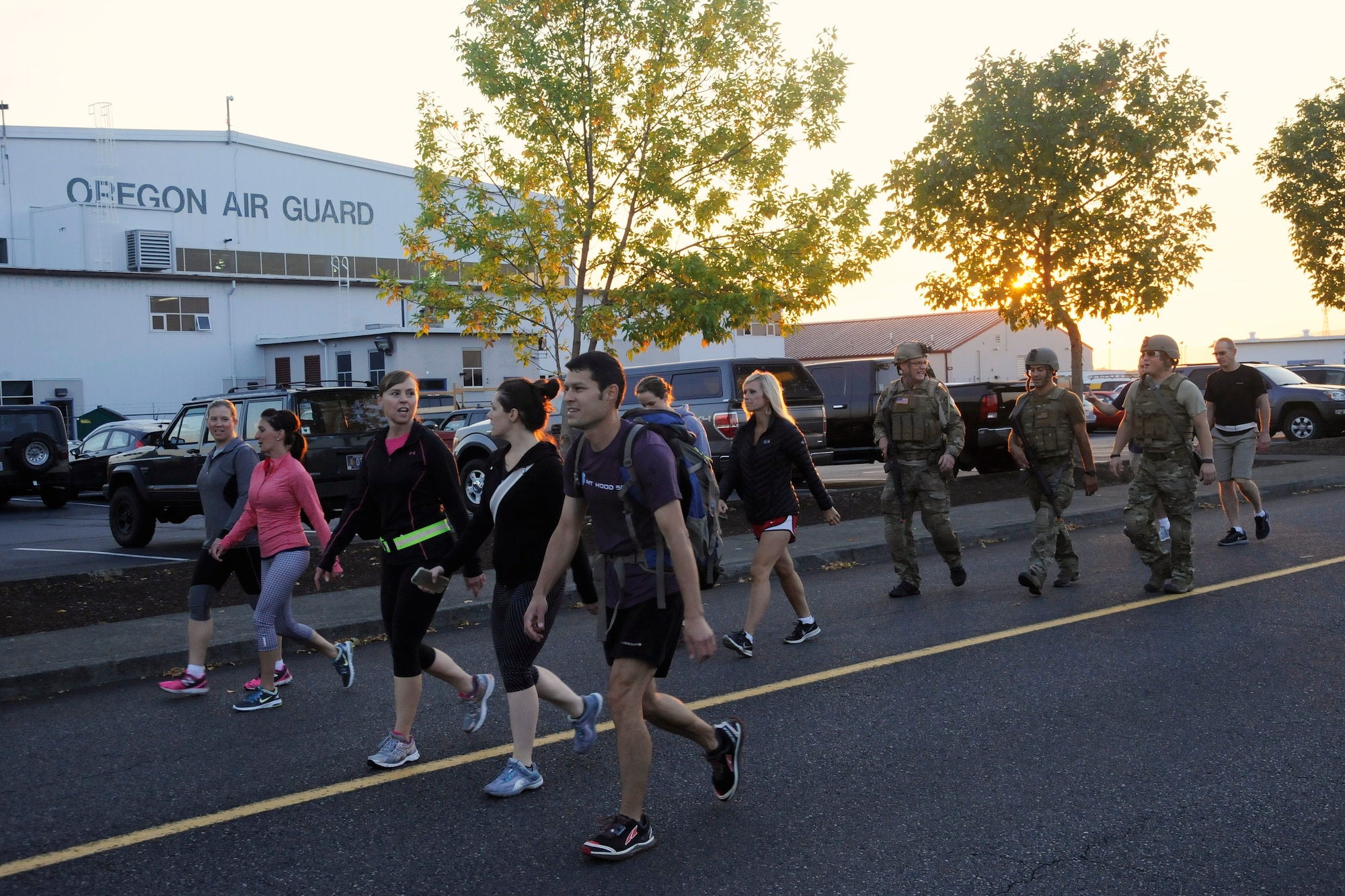 Participants from the 142nd Fighter Wing and 304th Rescue Squadron move along the route of the ‘Ruck, Run and Walk’, and pass the main hangar at the Portland Air National Guard Base, Ore., Sept 11, 2015. (U.S. Air National Guard photo by Tech. Sgt. John Hughel, 142nd Fighter Wing Public Affair/Released)