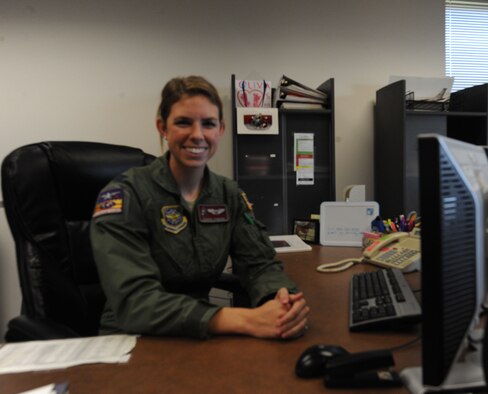 Capt. Jessica Rybicki, 384th Air Refueling Squadron executive officer and pilot, poses for her photo in her office Sept. 4, 2015, at McConnell Air Force Base, Kan. Rybicki is a KC-135 Stratotanker pilot and McConnell’s science, technology, engineering, and math program coordinator. She volunteers in the local community teaching children about the the principles of flight and astronautics. (U.S. Air Force Photo by Airman Jenna K. Caldwell)