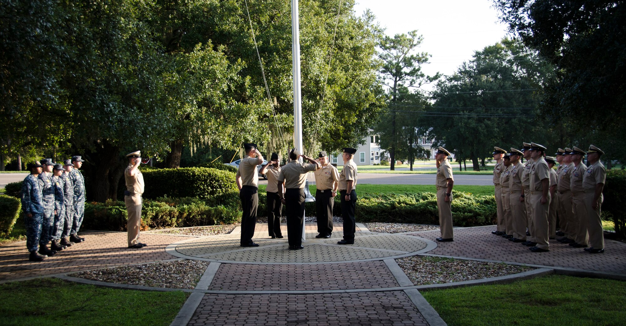 Sailors post the colors during a 9/11 remembrance ceremony at Joint Base Charleston – Weapons Station, S.C. After the posting of the colors, the Sailors observed a moment of silence and shared their experiences and history of the event. (U.S. Air Force photo/Staff Sgt. AJ Hyatt)
