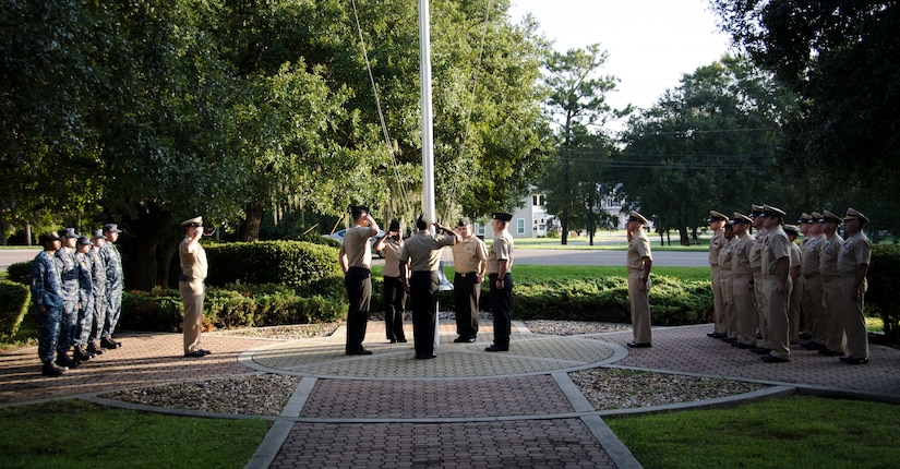 Sailors post the colors during a 9/11 remembrance ceremony at Joint Base Charleston – Weapons Station, S.C. After the posting of the colors, the Sailors observed a moment of silence and shared their experiences and history of the event. (U.S. Air Force photo/Staff Sgt. AJ Hyatt)