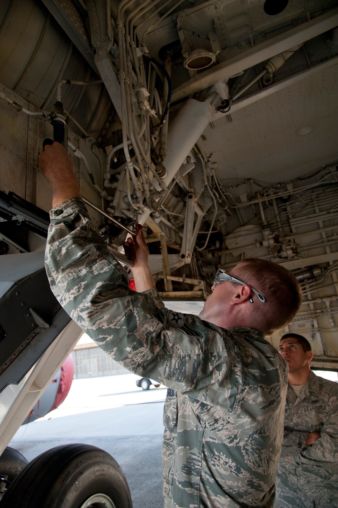 Senior Airman Matthew Jones, 92nd Maintenance Squadron aircraft structural maintenance specialist, fits a hand-made piece of steel to a KC-135 Stratotanker Sept. 9, 2015, at Fairchild Air Force Base, Wash. The 92nd MXS works closely with the 92nd Aircraft Maintenance Squadron ensuring the aircraft is fully operational. (U.S. Air Force photo/Airman 1st Class Mackenzie Richardson)