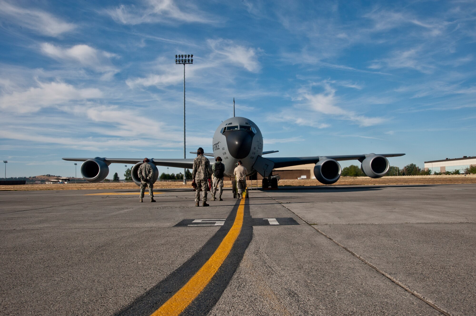 Members of the 92nd Aircraft Maintenance Squadron prepare to taxi a KC-135 Stratotanker Sept. 9, 2015, at Fairchild Air Force Base, Wash. The KC-135 has provided aerial refueling capability to the Air Force for more than 50 years. (U.S. Air Force photo/Airman 1st Class Mackenzie Richardson)