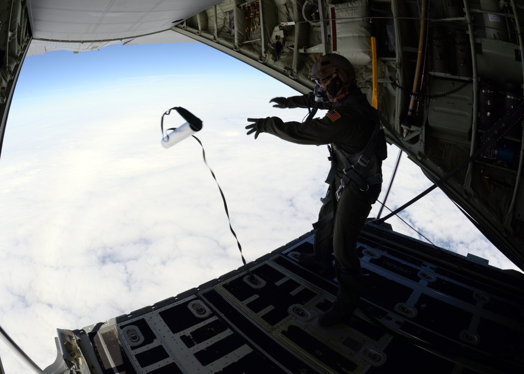 U.S. Air Force Senior Airman Jeremie Anderson, 67th Special Operations Squadron MC-130J Commando II loadmaster, launches an LUU-4/B flare from the back of an MC-130 J during a training mission Sept. 8, 2015, over the North Sea. Anderson launched flares for 48th Fighter Wing F-15 pilots to track, target and destroy. The 67th SOS and the 48th FW organized the two-day mission in order to provide realistic targeting training for F-15 pilots. Although the primary use of the flares are for search and rescue missions, instead they were used for targeting practice due to an upcoming expiration date. (U.S. Air Force photo by Tech. Sgt. Krystie Martinez/Released)