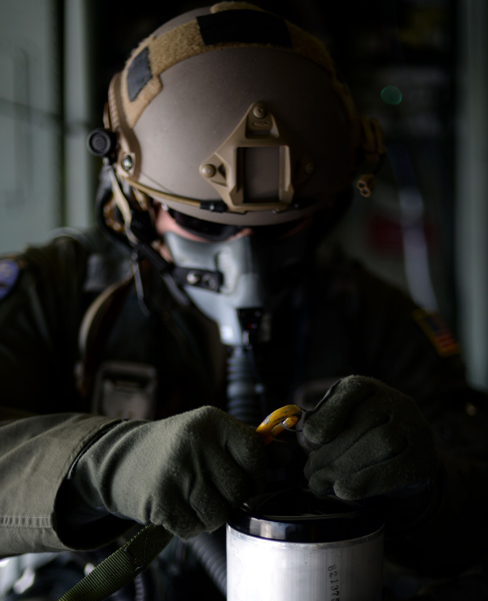 U.S. Air Force Senior Airman Jeremie Anderson, 67th Special Operations Squadron MC-130J Commando II loadmaster, prepares an LUU-4/B flare to be dropped during a training mission Sept. 8, 2015, over the North Sea. Anderson tossed the flares from the back of the aircraft for 48th Fighter Wing F-15 pilots to track, target and destroy. The 67th SOS and the 48th FW organized the two-day mission in order to provide realistic targeting training for F-15 pilots. Although the primary use of the flares are for search and rescue missions, instead they were used for targeting practice due to an upcoming expiration date. (U.S. Air Force photo by Tech. Sgt. Austin May/Released)