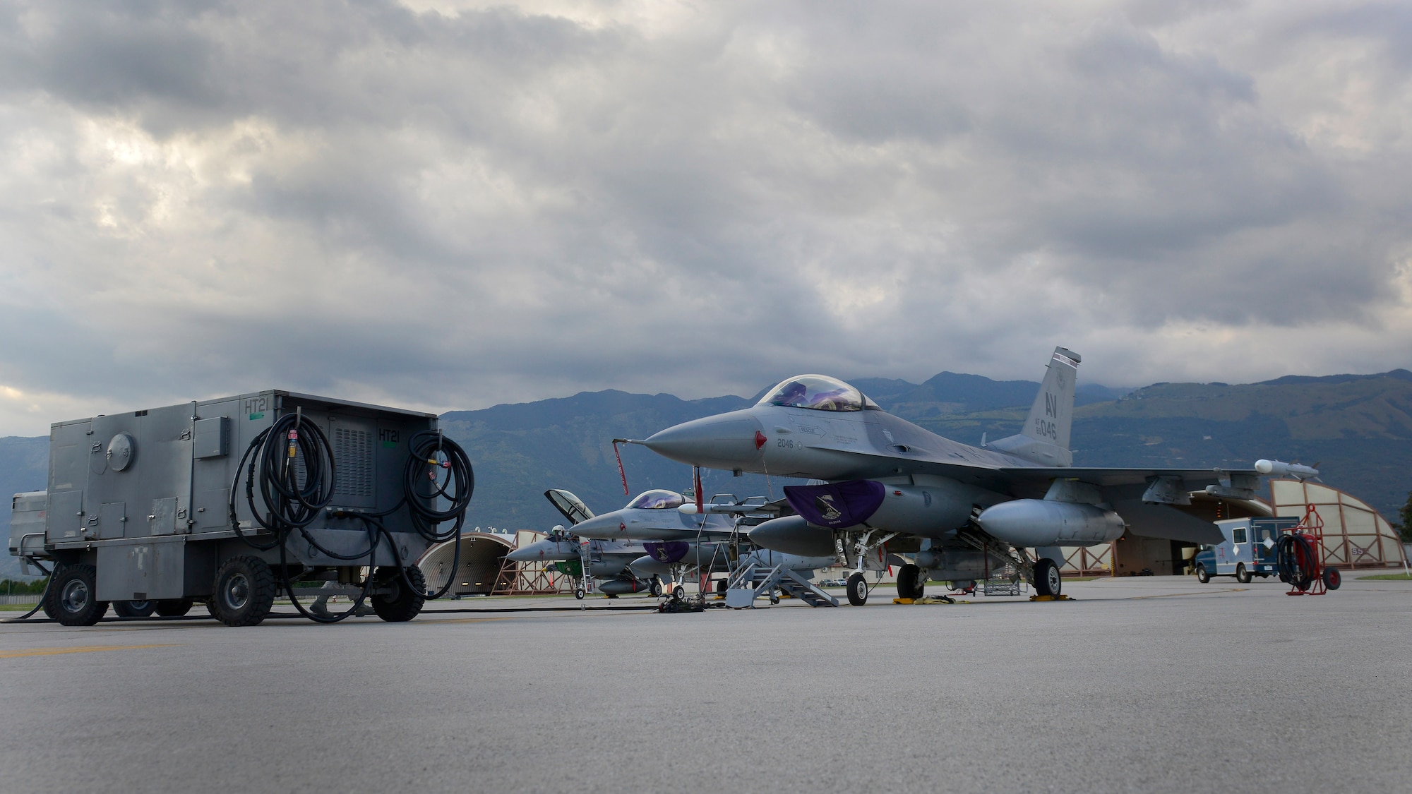 Three F-16 Fighting Falcons sit on the flightline, Sept. 9, 2015, at Aviano Air Base, Italy. Airmen from several maintenance shops worked together to prepare aircraft for flights. (U.S. Air Force photo by Airman 1st Class Cary Smith/Released)