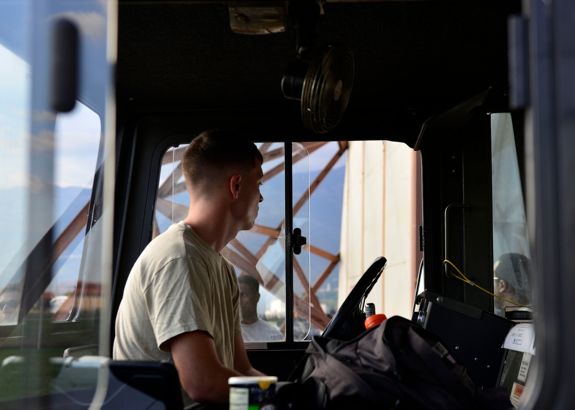 U.S. Air Force Airman 1st Class Caleb Butt, 31st Aircraft Maintenance Squadron crew chief, waits to tow an F-16 Fighting Falcon, Sept. 9, 2015, at Aviano Air Base, Italy. Crew chiefs work around the clock to ensure F-16s are mechanically ready to fly. (U.S. Air Force photo by Airman 1st Class Cary Smith/Released)