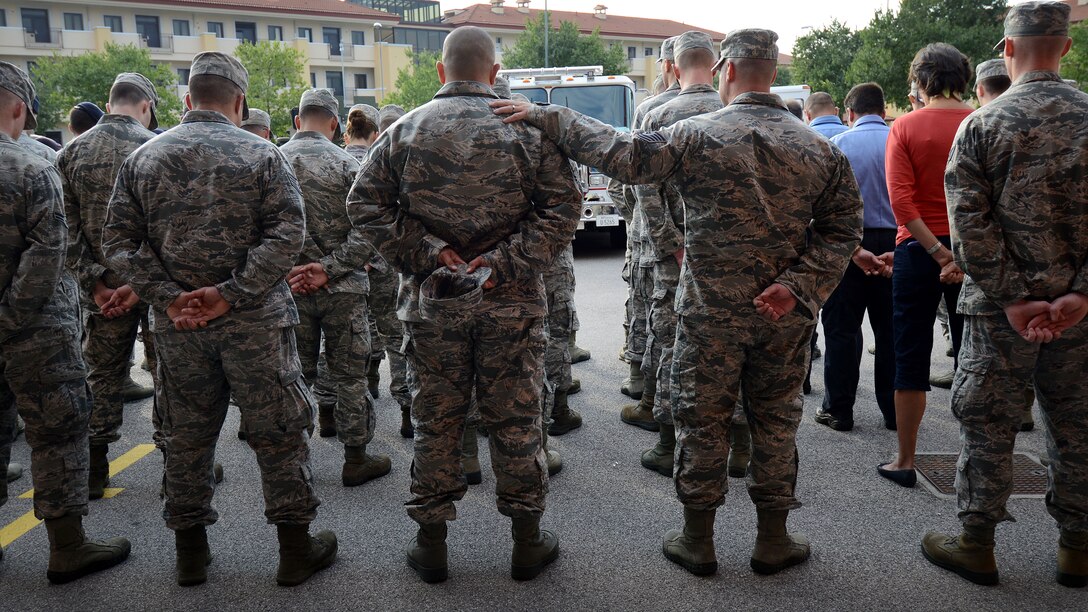 U.S. Air Force Airmen with the 31st Civil Engineer Squadron stand in formation during a 9/11 ceremony Sept. 11, 2015, at Aviano Air Base, Italy.  The ceremony was held to commemorate the 14th anniversary of the Sept. 11, 2001 terrorist attacks that claimed the lives of approximately 3,000 innocent people at the World Trade Center, Shanksville, Penn., and the Pentagon. (U.S. Air Force photo by Staff Sgt. Evelyn Chavez/Released)