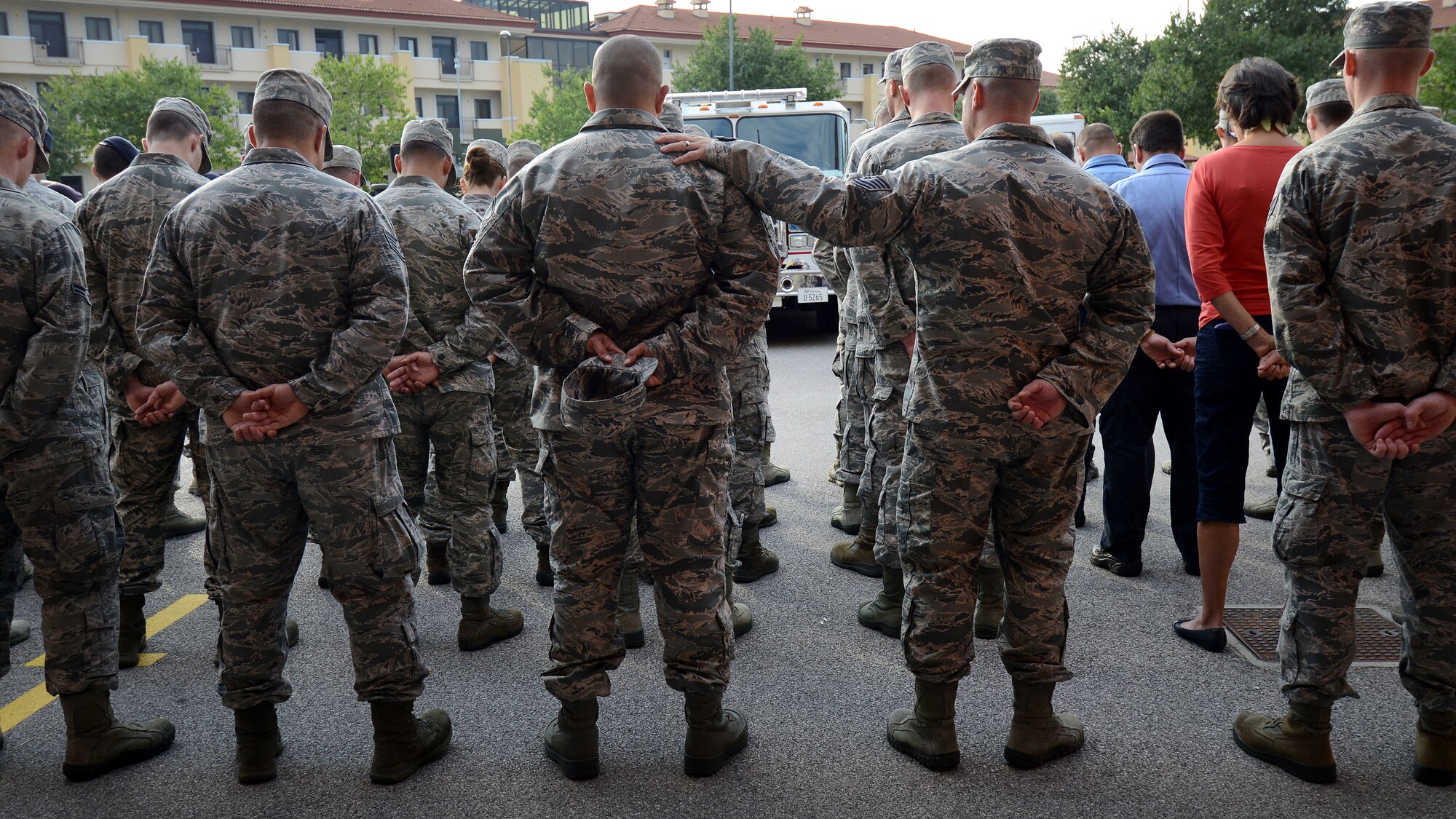 U.S. Air Force Airmen with the 31st Civil Engineer Squadron stand in formation during a 9/11 ceremony Sept. 11, 2015, at Aviano Air Base, Italy.  The ceremony was held to commemorate the 14th anniversary of the Sept. 11, 2001 terrorist attacks that claimed the lives of approximately 3,000 innocent people at the World Trade Center, Shanksville, Penn., and the Pentagon. (U.S. Air Force photo by Staff Sgt. Evelyn Chavez/Released)