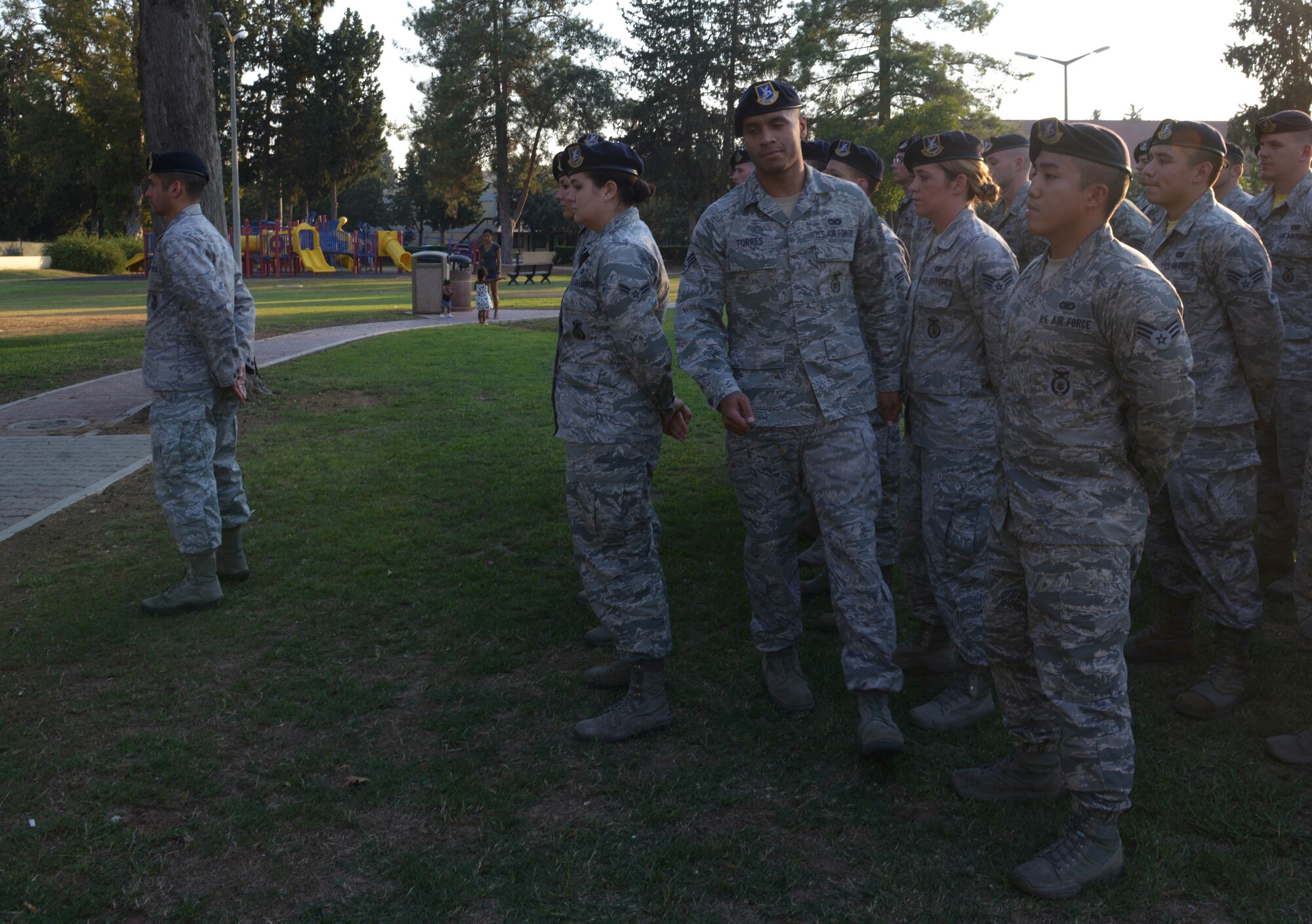 Senior Airman Carlos Torres, 39th Security Forces Squadron commander support staff, takes part in a Bridge Ceremony Aug. 28, 2015, at Incirlik Air Base, Turkey.  Torres, and other newly selected staff sergeants, were called out of the formation of Airmen to participate in a ceremony signifying their transition into the NCO corps. (U.S. Air Force photo by Senior Airman Krystal Ardrey/Released) 
