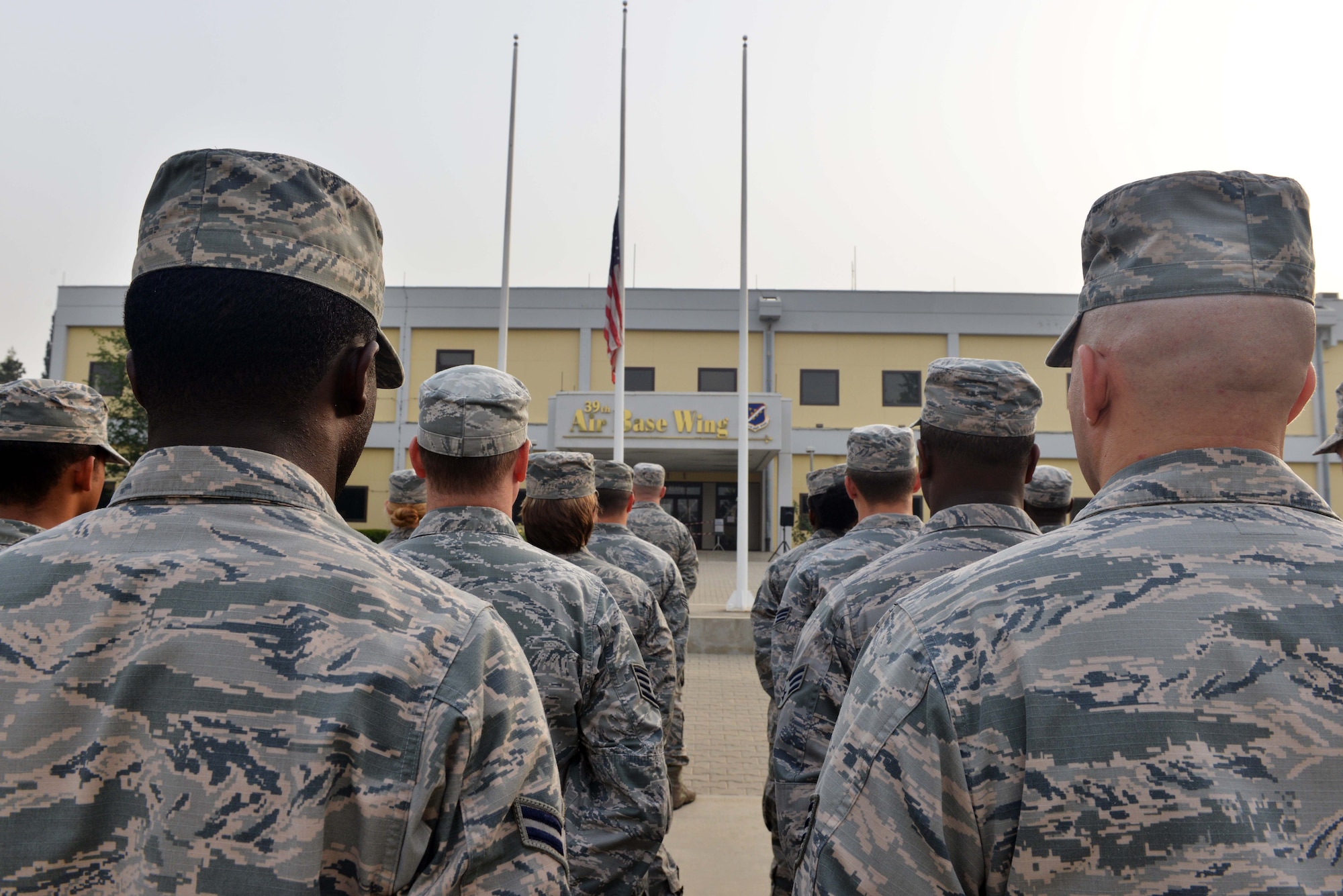 Airmen from the 39th Air Base Wing stand in formation during a 9/11 Remembrance Ceremony to honor and remember the victims of the attacks Sept. 11, 2015, at Incirlik Air Base, Turkey. Approximately 200 Airmen from across the 39th ABW attended the event. (U.S. Air Force photo by Senior Airman Michael Battles)