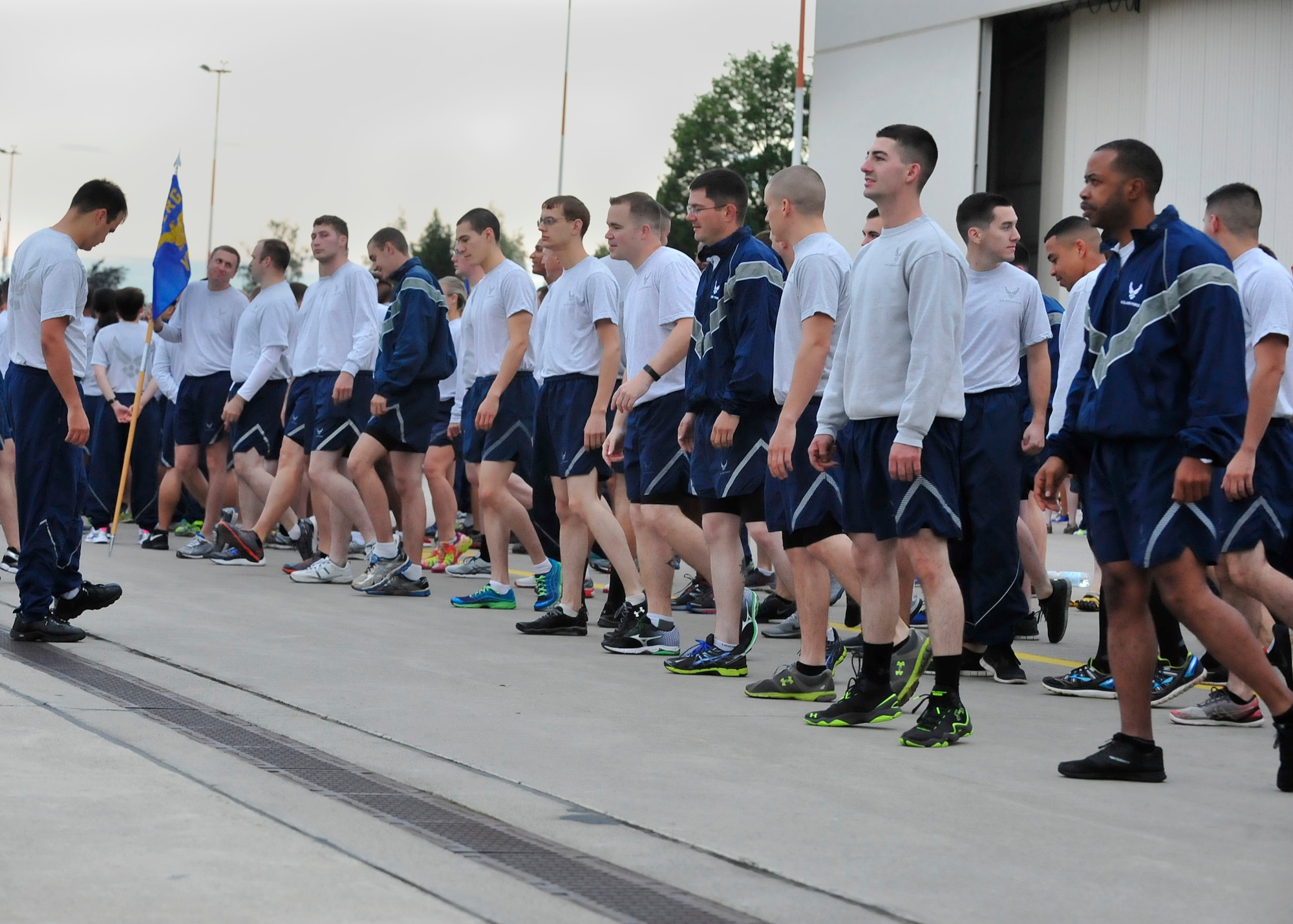Airmen from the 86th Logistics Readiness Group stretch together before the third tri-wing run of the year, Sept. 3, 2015, at Ramstein Air Base, Germany. Wing runs are just one event commanders hold throughout the year to keep Airmen physically fit, resilient and ready to respond. (U.S. Air Force photo/Airman 1st Class Larissa Greatwood) 