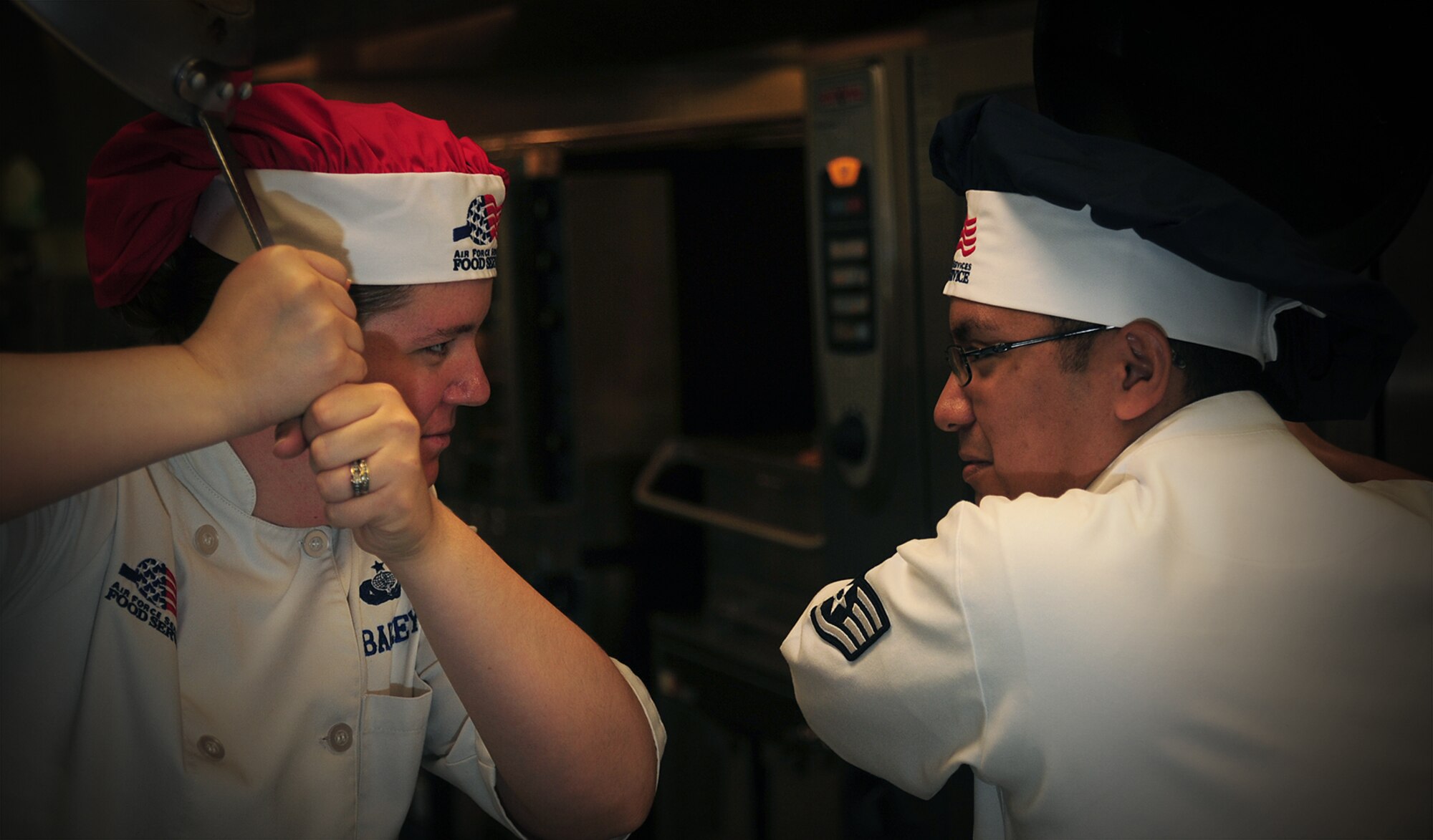 Members of the 509th Force Support Squadron pose for a photo prior to the Global Strike Iron Chef Challenge at Whiteman Air Force Base, Mo., Sept. 4, 2015. Two teams faced off in an hour-long cooking challenge for a chance to advance to the major command level at Barksdale AFB, La. 
(U.S. Air Force photo by Airman 1st Class Jovan Banks/Released)
