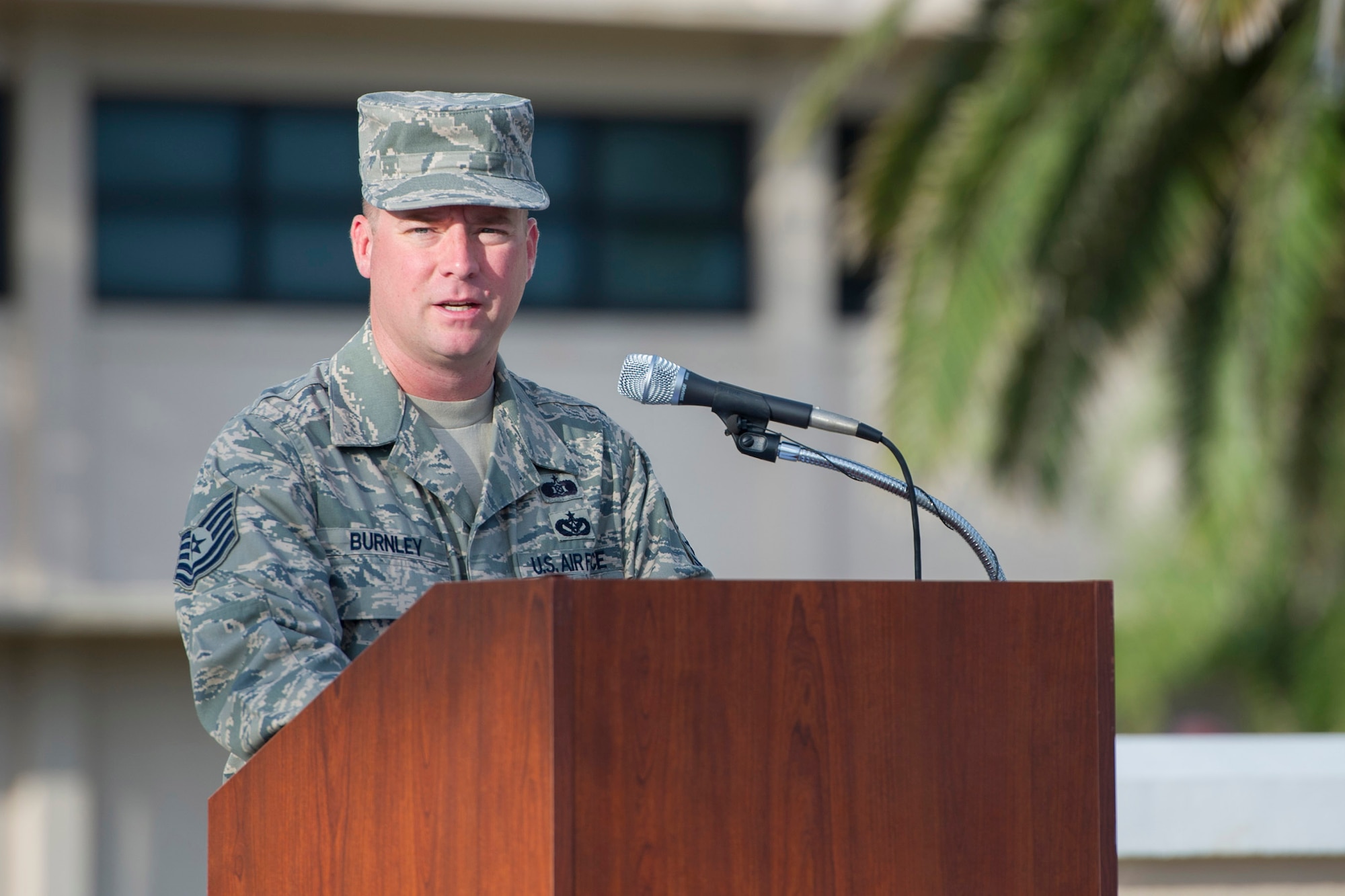 Tech. Sgt. Aaron Burnley, 45th Space Wing Emergency Management Training NCO in charge and primary narrator, shares with members at Patrick Air Force Base, Fla., Sept. 11, 2015, that we will never forget how Americans responded in New York City, at the Pentagon, and over the skies of Pennsylvania. Members of Team Patrick-Cape gathered at the base flag pole to honor those who lost their lives 14 years ago on 9/11/01.  (U.S. Air Force photos/Matthew Jurgens) (Released)  
