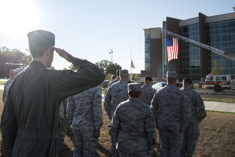 First responders salute during a Patriot's Day Reveille Ceremony at Heritage Park, Joint Base Andrews, Md., Sept. 11, 2015. The paid tribute to the first responders and victims of the terrorist attacks on Sept. 11, 2001. (U.S. Air Force photo by Airman 1st Class Philip Bryant/released) 