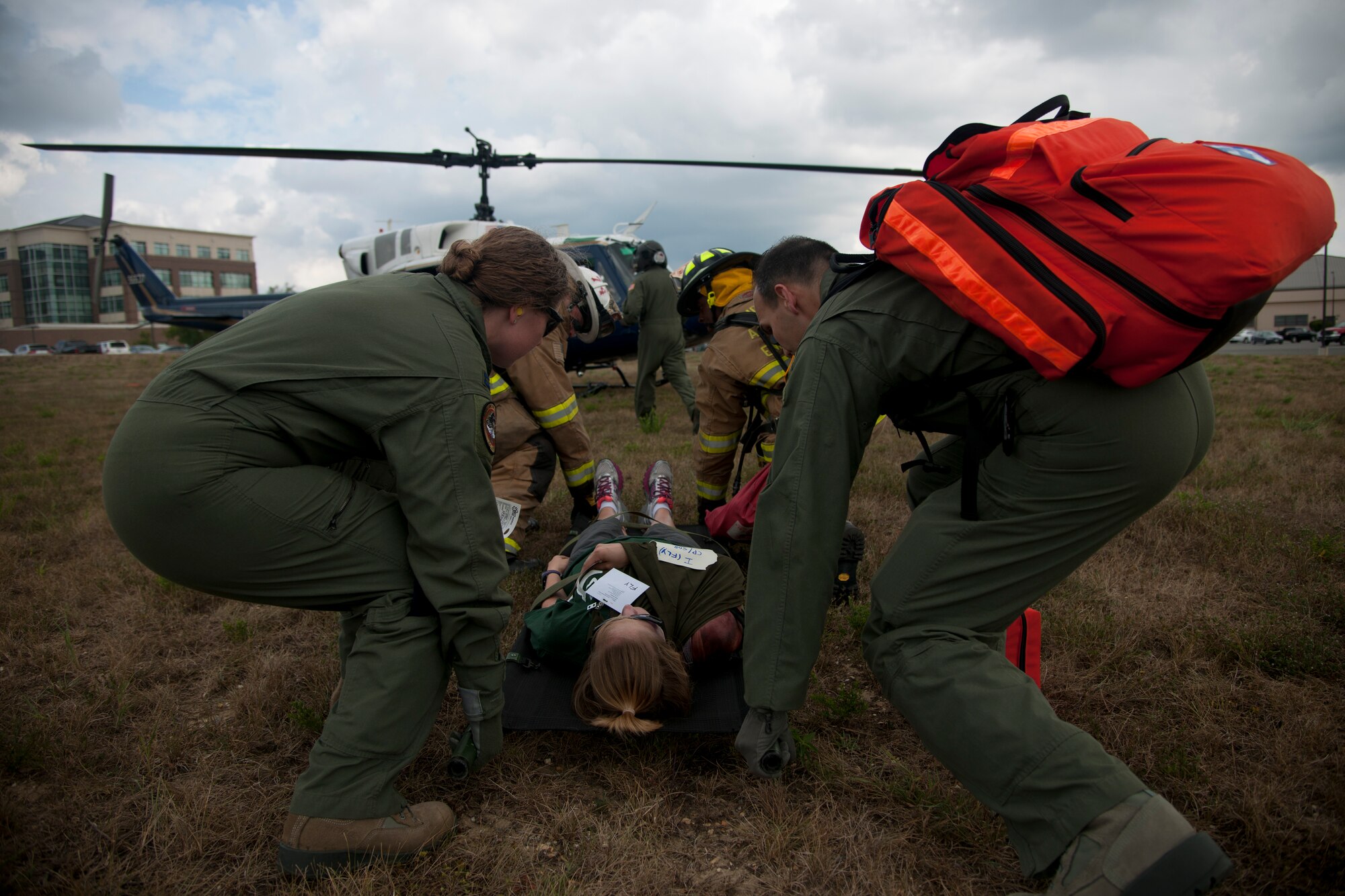 Members of the 1st Helicopter Squadron carry a litter to a UH-1N Twin Huey at Joint Base Andrews, Md., Sept. 10, 2015. The exercise tested a variety of preparedness aspects including first response and transporting patients to ambulances and helicopters. (U.S. Air Force photo/ Airman 1st Class J.D. Maidens/released)