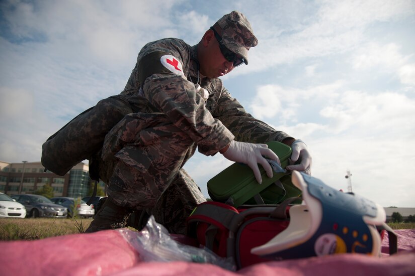 2nd Lt. Edward Antonio, 779th Flight Medicine clinical nurse, sets up gear for an exercise at Joint Base Andrews, Md., Sept. 10, 2015. The 779th AMDS tested preparedness with a simulated plane crash. (U.S. Air Force photo/ Airman 1st Class J.D. Maidens/released)
