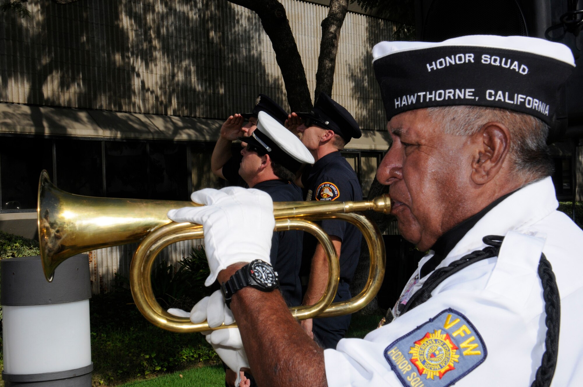 A VFW Honor Squad member plays taps at the City of Hawthorne’s annual 9-11 ceremony. (Photo by Joe Juarez)