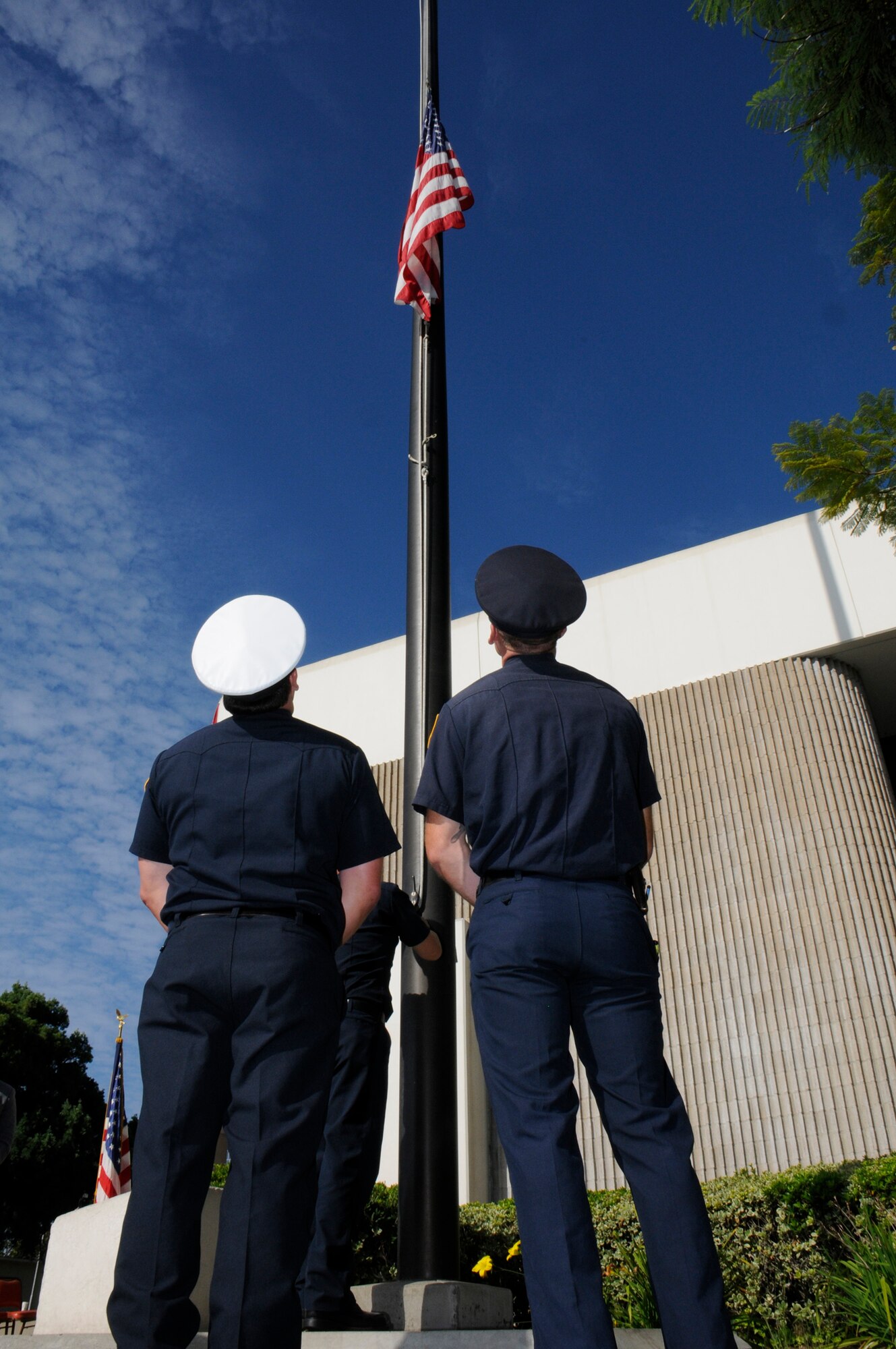 A flag flies at half-staff in front of the Hawthorne City Hall in honor of those who lost their lives on Sept. 11, 2001. (Photo by Joe Juarez)