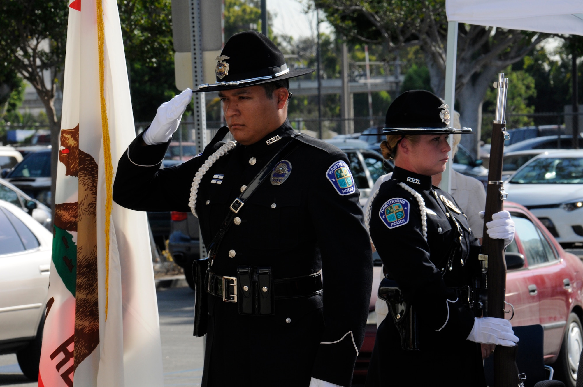 An Honor Guard from the Hawthorne Police Department salutes the colors at the start of the city’s 9-11 ceremony. (Photo by Joe Juarez)