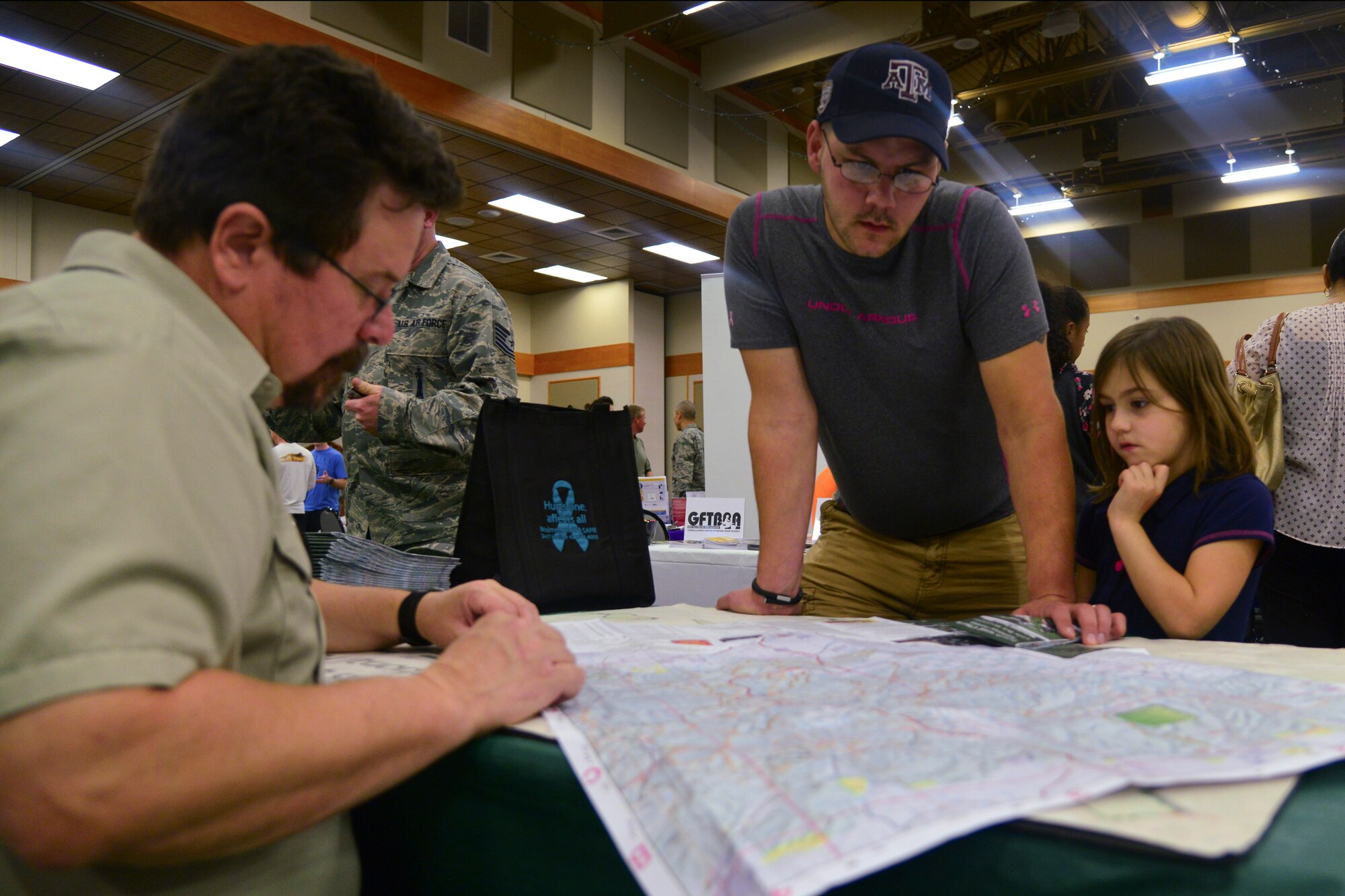 Airmen and families attend the 2nd Annual Community Fair, held at Malmstrom Air Force Base, Mont., Sept. 9, 2015, at the Grizzly Bend. Airmen of all ranks attended the event to learn a more about what Montana has to offer. (U.S. Air Force photo/Airman Daniel Brosam)