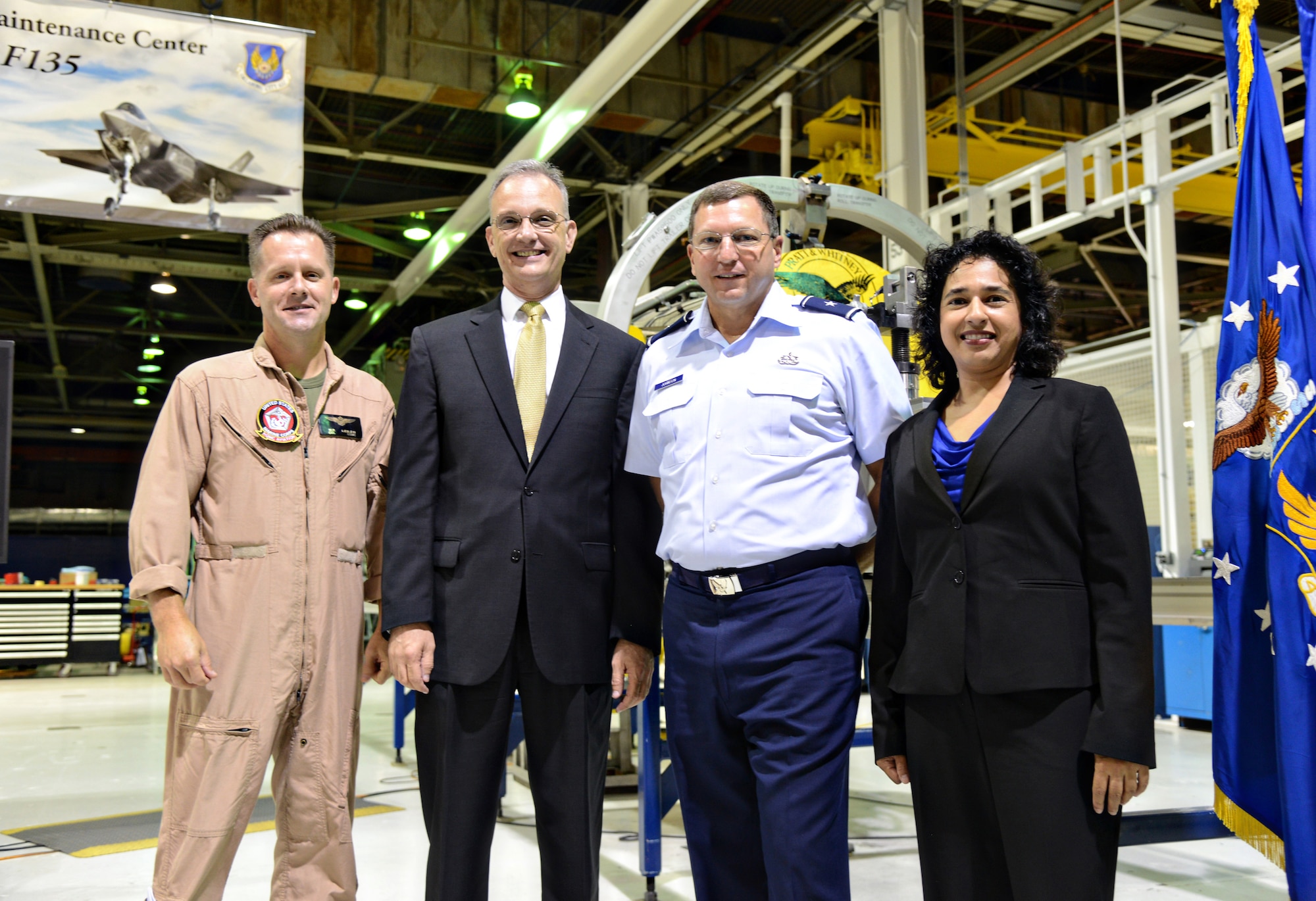 Col. William Lieblein, deputy chief of the Marine Corps Aviation Weapons Branch; Russell Howard, assistant deputy commandant for Aviation (Sustainment), Headquarters U.S. Marine Corps; Brig. Gen. Mark Johnson, commander of the Oklahoma City Air Logistics Complex, and Cheryl Lobo, F135 programs director for Pratt & Whitney, joined in a celebration on Sept. 1 to thank the F135 team from the Oklahoma City Heavy Maintenance Center for their hard work and dedication to the mission. (Air Force photo by Kelly White/Released)