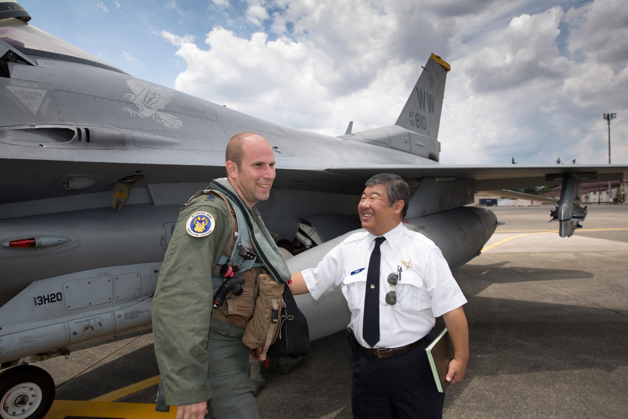 Lt. Col. Kevin Lord, 35th Fighting Wing inspector general, and Keita Nanko, 374th Operations Support Squadron air traffic specialist, reunite at Yokota Air Base, Japan, 24 July 2015. Lord grew up at Yokota and earned his personal pilots license here as a 17-year old boy; Nanko was his instructor. (U.S. Air Force photo by Osakabe Yasuo/Released)