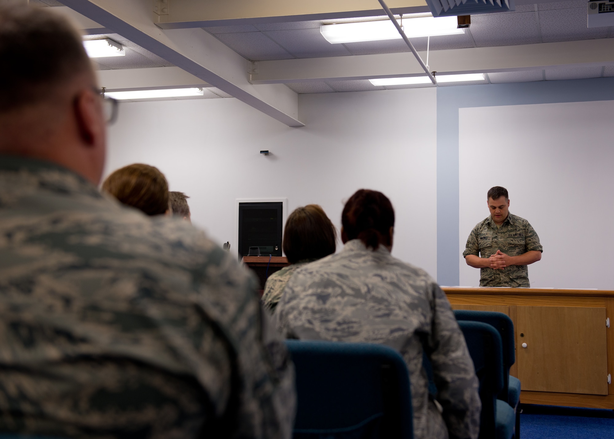 Chaplain White speaks to members of the 102nd IW honoring the memory of the victims of 9/11. By Staff Sgt. Veuril McDavid