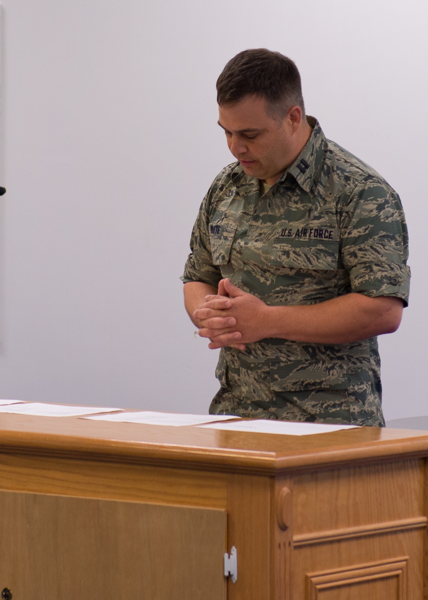 Capt. Derek White, Chaplain 102nd IW speaks to members of the 102nd during a 9/11 morning's service. By Staff Sgt. Veuril McDavid