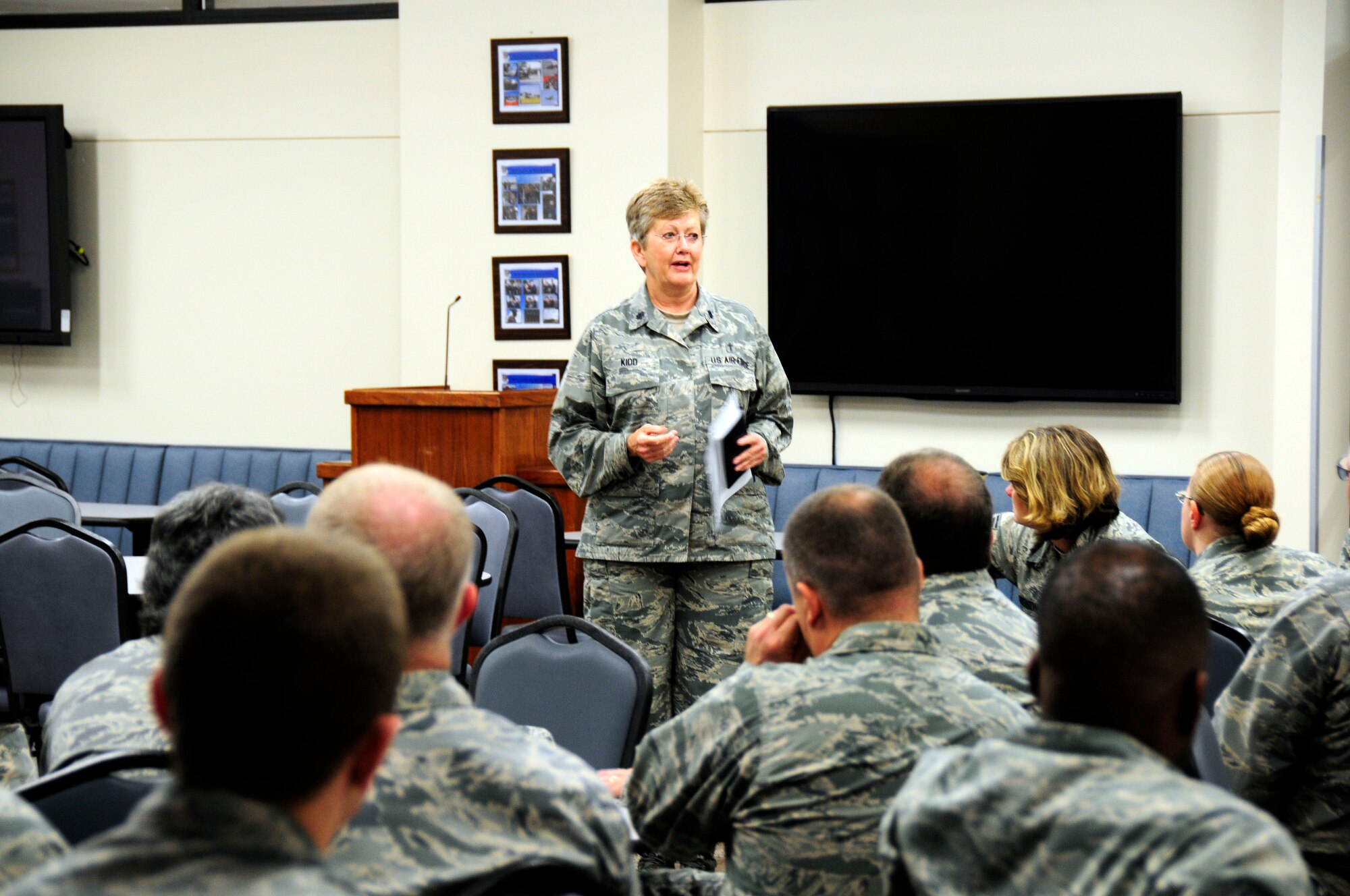 U.S. Air Force Chaplain (Lt. Col.) Debra Kidd, 145th Airlift Wing, shares thoughts, prayer and gives encouragement during a 9/11 remembrance service held at the North Carolina Air National Guard Base, Charlotte Douglas International Airport, Sept 11, 2015. Time was taken for reflection during a moment of silence to honor and remember those who lost their lives, 14 years ago today. (U.S. Air National Guard photo by Master Sgt. Patricia F. Moran, 145th Public Affairs/Released)