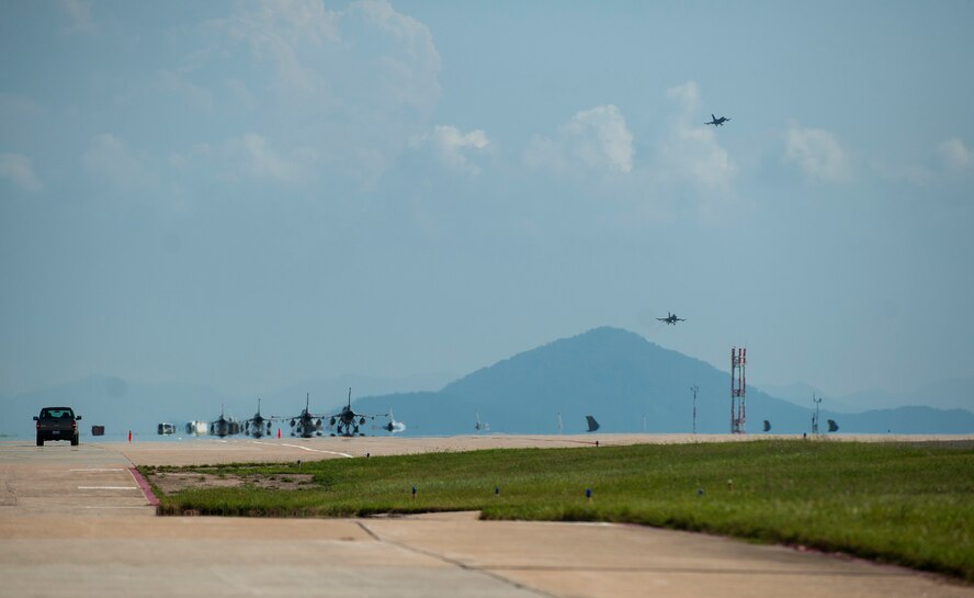 F-16 Fighting Falcons from the 175th Expeditionary Fighter Squadron, 114th Fighter Wing, South Dakota Air National Guard, taxi to the runway before takeoff as part of a theater security package at Kunsan Air Base, Republic of Korea, Sept. 3, 2015.  TSPs are one of Pacific Air Forces’ contributions to Theater Security Cooperation as the U.S. air component in the region and they ensure shared international responsibilities to provide assistance during regional crises. (U.S. Air Force photo by Staff Sgt. Nick Wilson/Released) 