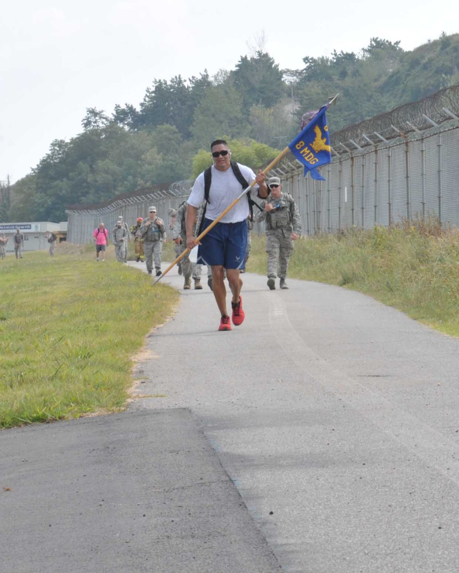 Members of the 8th Fighter Wing participate in a ruck march in remembrance of 9/11 at Kunsan Air Base, Republic of Korea, September 11, 2015. Airmen participated in the ruck march to honor those that gave their lives September 11, 2001. (U.S. Air Force photo by SrA Dustin King/Released)