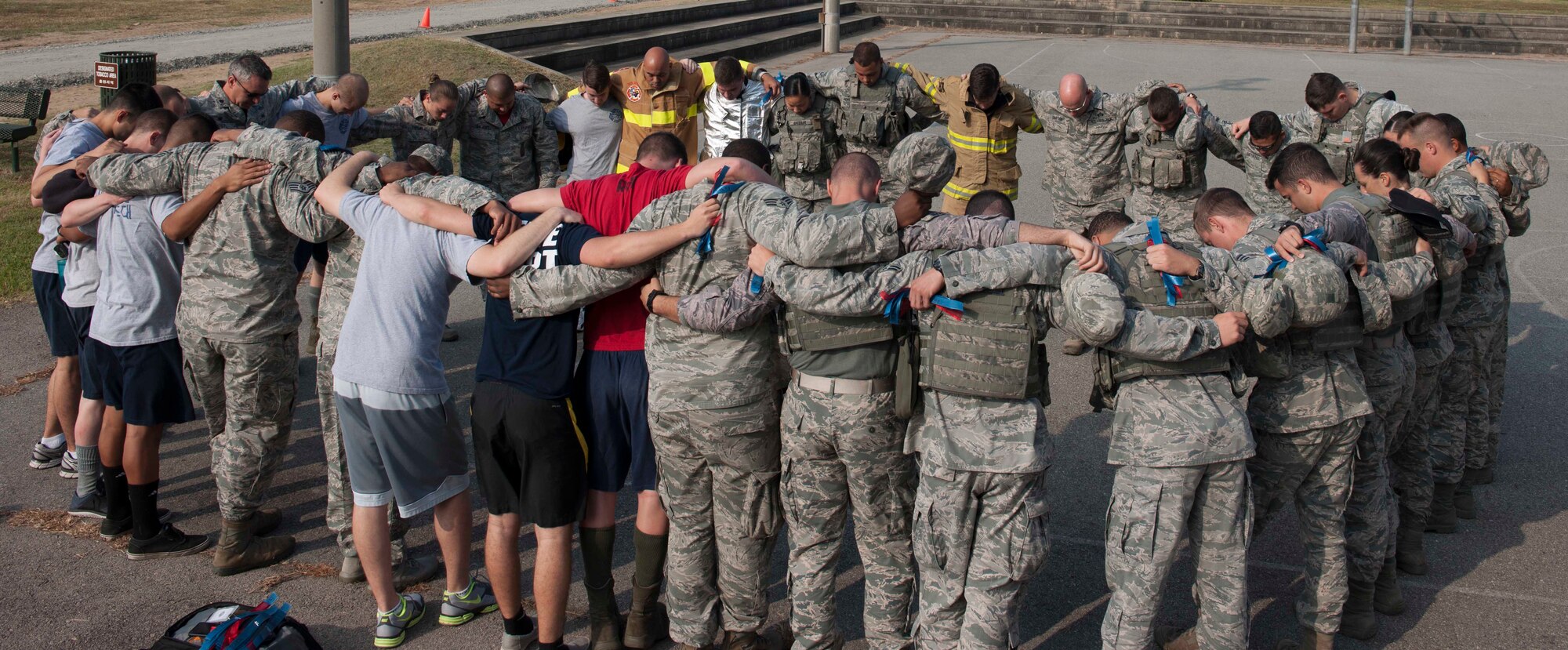 Members of the 8th Fighter Wing participate in  stair climb in remembrance of 9/11 at Kunsan Air Base, Republic of Korea, September 11, 2015. Airmen climb these steps to simulate the 110 stories that first responders climbed and to honor the memory of 343 individuals that made the ultimate sacrifice ultimate sacrifice, September 11, 2001. (U.S. Air Force photo by SrA Dustin King/Released)