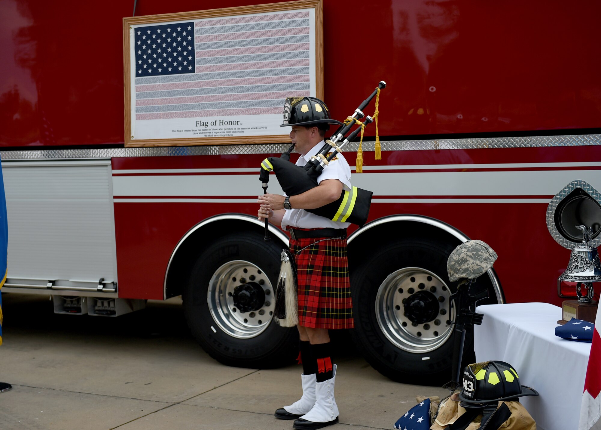 ALTUS AIR FORCE BASE, Okla. – A Lawton Fire Department member, Capt. Mark Schucker, plays Amazing Grace during a 9/11 remembrance ceremony outside the base fire department, Sept. 11, 2015. The ceremony started with a joint honor guard followed by the firefighters’, security forces’and medics’ prayer, a flag folding and finished with the sounding of the last alarm. (U.S. Air Force photo by Airman 1st Class Kirby Turbak/Released)
