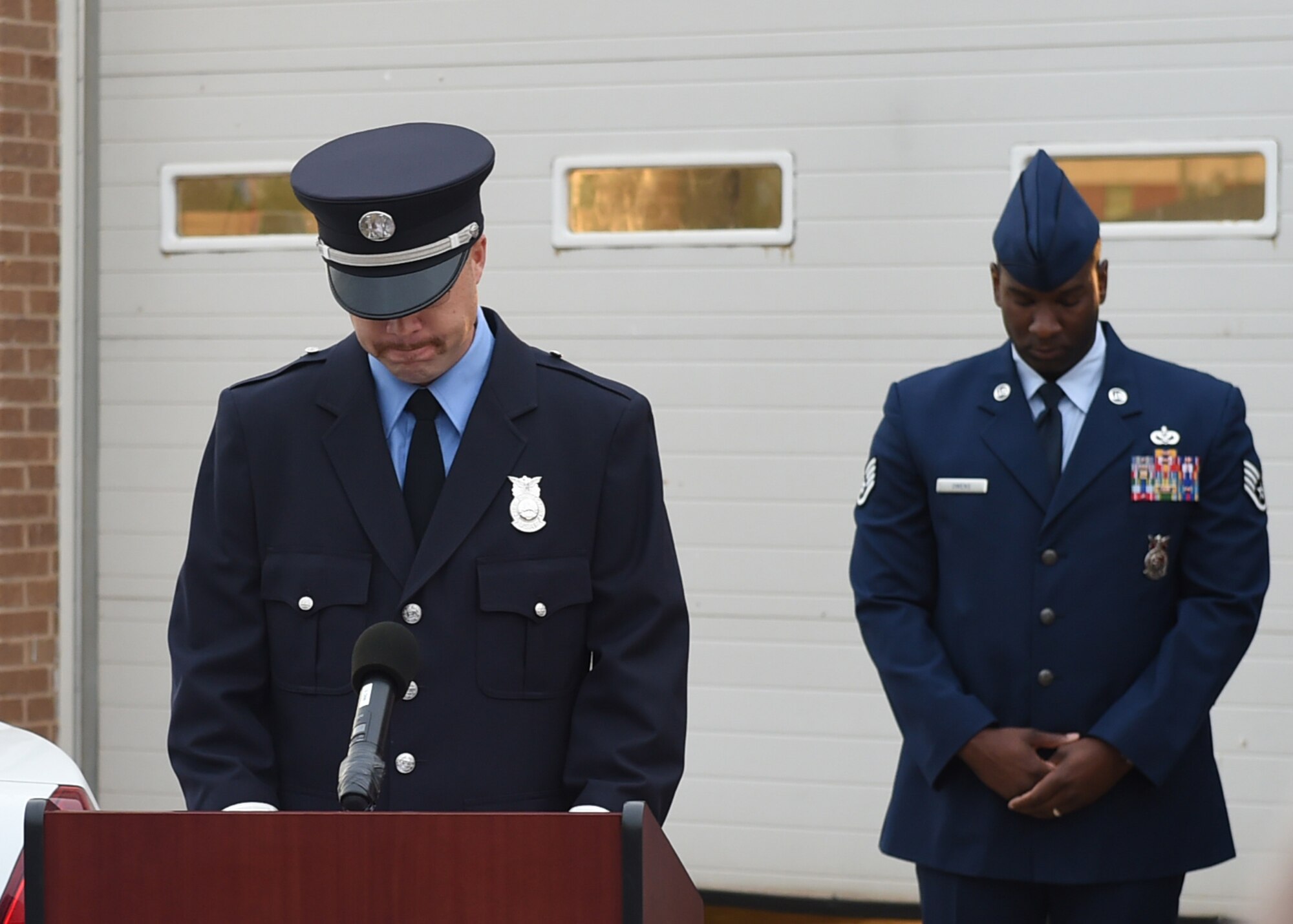 ALTUS AIR FORCE BASE, Okla. – Douglas Shimmin, 97th Civil Engineer Squadron lead firefighter, reads the firefighters’ prayer outside the base fire department during a 9/11 remembrance ceremony, Sept. 11, 2015. Airmen from the 97th CES Fire Department, 97th Security Force Squadron and 97th Medical Group each prayed during the ceremony. (U.S. Air Force photo by Airman 1st Class Kirby Turbak/Released)