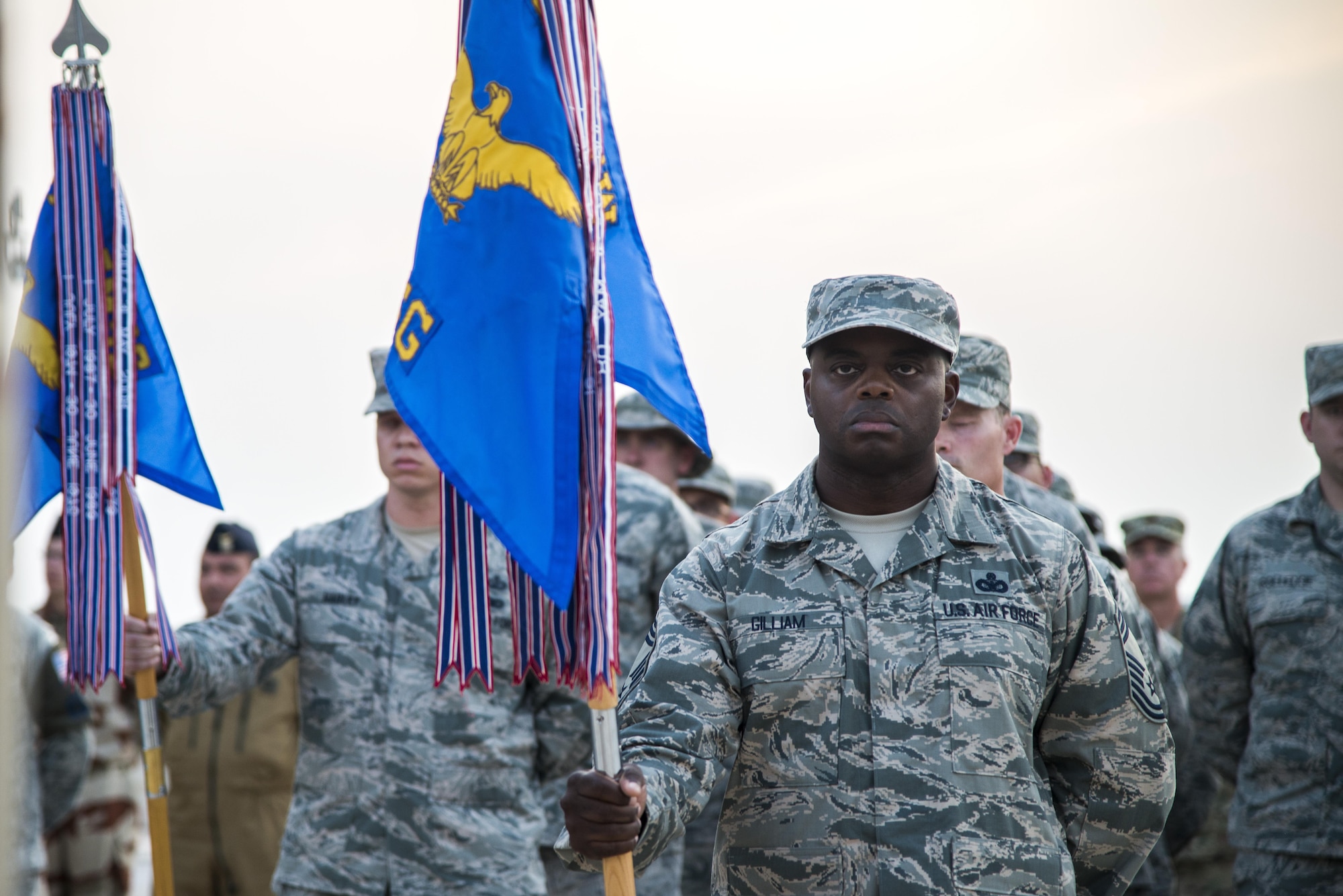 U.S. Air Force Airmen along with coalition forces stand in
formation during a retreat ceremony recognizing the fourteenth anniversary of Sept. 11, 2001, at Al Udeid Air Base, Qatar, Sept. 11, 2015. The retreat ceremony signals the end of the official duty day and serves as a ceremony
for paying respect to the flag. In this ceremony, respect was paid to the flag and the memory of those lost on Sept. 11, 2001. (U.S. Air Force photo/Tech. Sgt. Rasheen Douglas)
