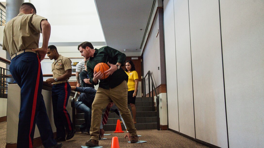 A team completes a leadership exercise during the Marine Corps Leadership Seminar at Arizona State University at Tempe, Arizona, Sept. 11, 2015. The seminar was an event supporting Marine Week Phoenix, which aims to connect the Corps with the people of Arizona.