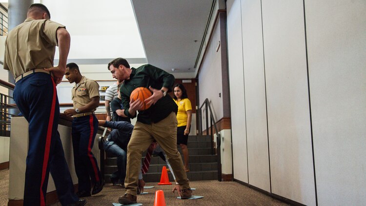 A team completes a leadership exercise during the Marine Corps Leadership Seminar at Arizona State University at Tempe, Arizona, Sept. 11, 2015. The seminar was an event supporting Marine Week Phoenix, which aims to connect the Corps with the people of Arizona.