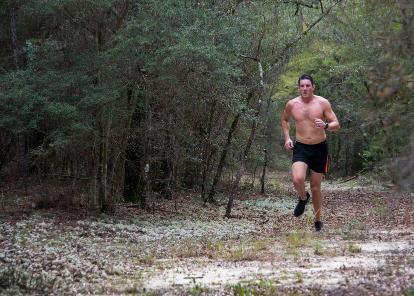 Maj. Austin White, 5th Special Operations Squadron, runs during the “Never Forget” trail run at Duke Field, Fla., Sept. 12. The run honored those members of Air Force Special Operations Command who fell in service since 9/11. More than 45 Airmen ran past signs with names, dates and locations of the 61 deceased Airmen throughout the three-mile trail. (U.S. Air Force photo/Tech. Sgt. Jasmin Taylor)