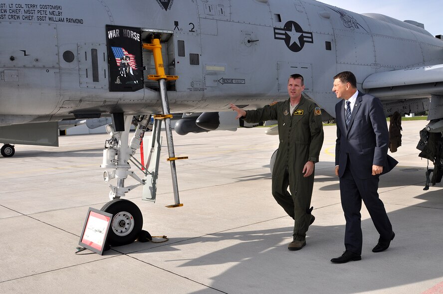 Lt. Col. Kevin Boblet, an A-10 Thunderbolt II pilot with the 303d Fighter Squadron, 442d Fighter Wing out of Whiteman Air Force Base, Mo., talks with Latvian President Raimonds Vējonis about the functions and capabilities of the A-10 at Lielvarde Air Field Sept. 8. Boblet and his wingman Capt. Nathan Bevis, flew a two-ship sortie to the air field to take part in the Distinguished Visitor event that is part of Operation Atlantic Resolve. (U.S. Air Force photo by Capt. Denise Haeussler)