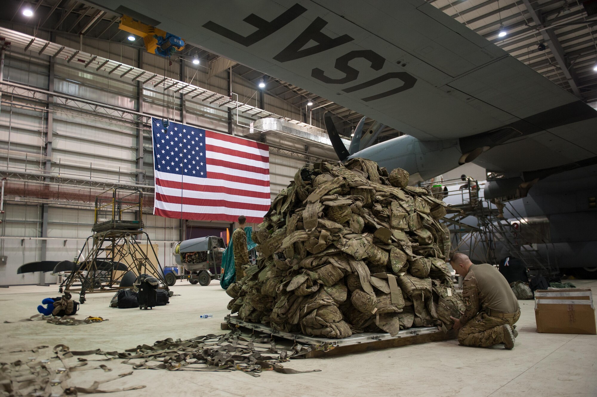 A U.S. Airman assigned to the 774th Expeditionary Airlift Squadron prepares a pallet before it is loaded onto a C-130J Super Hercules aircraft at Bagram Airfield, Afghanistan, Sept. 12, 2015. The Airman and the rest of his squadron were in the process of redeploying back to Little Rock Air Force Base after successfully completing their deployment. During their rotation as the 774th Expeditionary Airlift Squadron, the Little Rock team completed 1,850 combat sorties and moved 14,500 passengers and 17 million pounds of cargo.  (U.S. Air Force photo by Tech. Sgt. Joseph Swafford/Released)