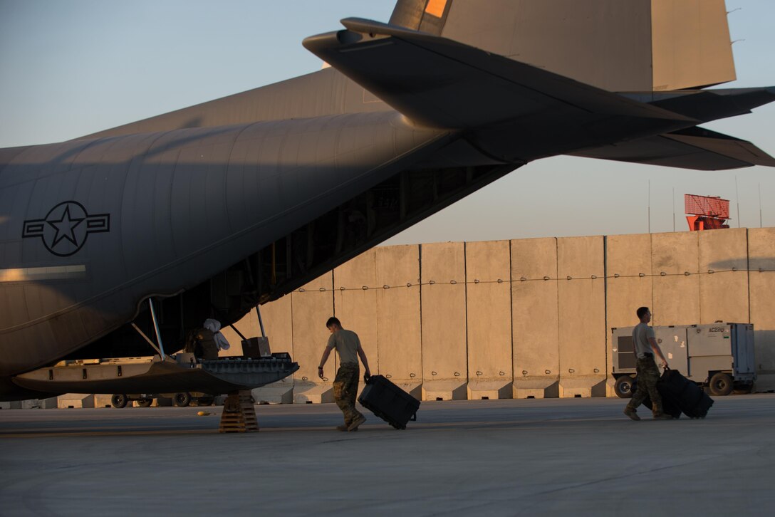 U.S. Airmen assigned to the 774th Expeditionary Airlift Squadron completes loading luggage onto a C-130J Super Hercules aircraft at Bagram Airfield, Afghanistan, Sept. 12, 2015. The Airmen and the rest of their squadron were in the process of redeploying back to Little Rock Air Force Base after successfully completing their deployment. During their rotation as the 774th Expeditionary Airlift Squadron, the Little Rock team completed 1,850 combat sorties and moved 14,500 passengers and 17 million pounds of cargo.  (U.S. Air Force photo by Tech. Sgt. Joseph Swafford/Released)