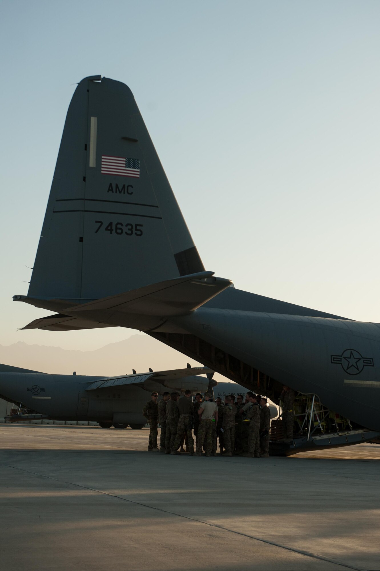 U.S. Airmen assigned to the 774th Expeditionary Airlift Squadron have a preflight meeting outside of a C-130J Super Hercules aircraft at Bagram Airfield, Afghanistan, Sept. 12, 2015. The Airmen and the rest of their squadron were in the process of redeploying back to Little Rock Air Force Base after successfully completing their deployment. During their rotation as the 774th Expeditionary Airlift Squadron, the Little Rock team completed 1,850 combat sorties and moved 14,500 passengers and 17 million pounds of cargo.  (U.S. Air Force photo by Tech. Sgt. Joseph Swafford/Released)